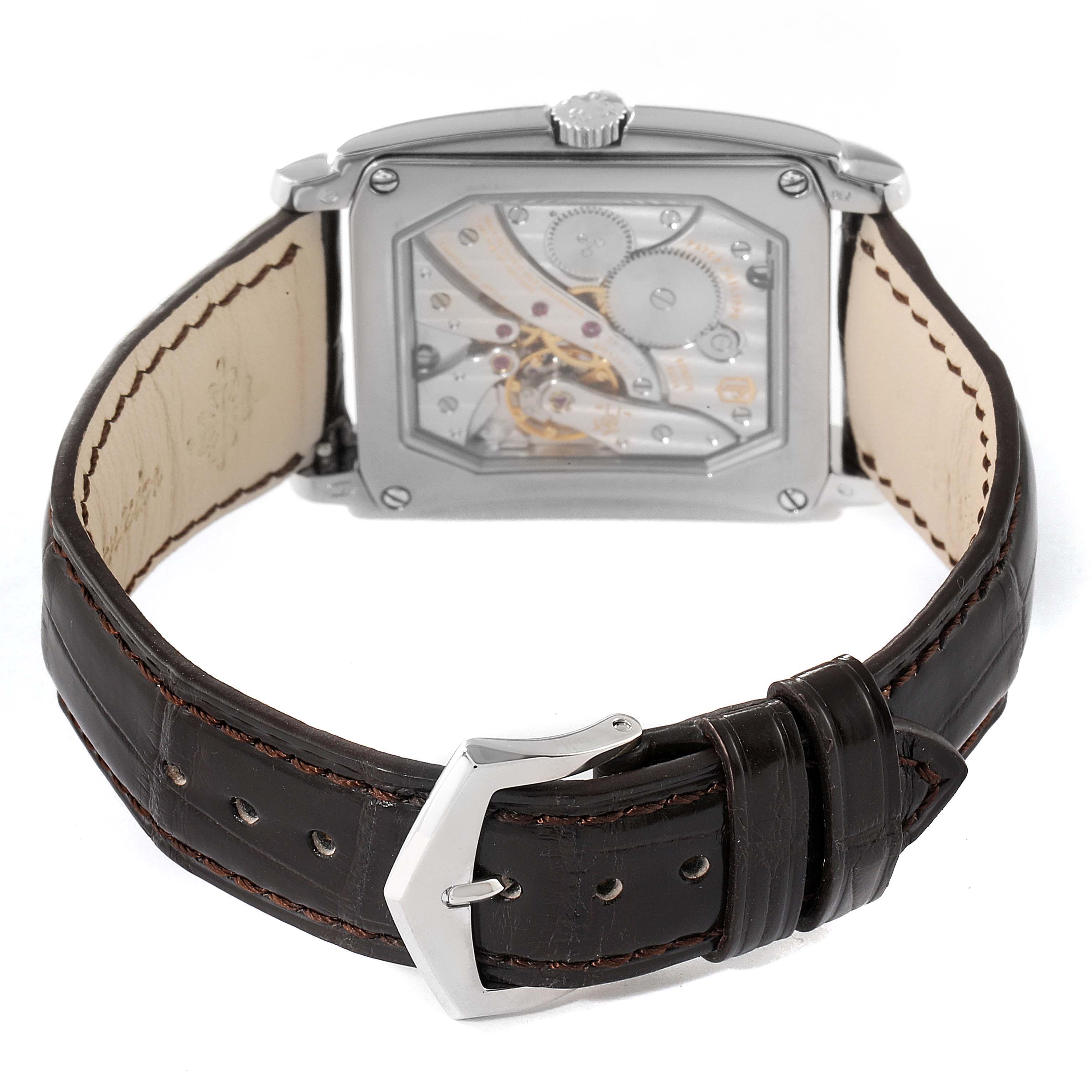 This image shows the back view of a Patek Philippe Gondolo 5124G-001 Men's White Gold Pink Dial 5124G-001 Men's White Gold Pink Dial watch, displaying its mechanism and brown leather strap.