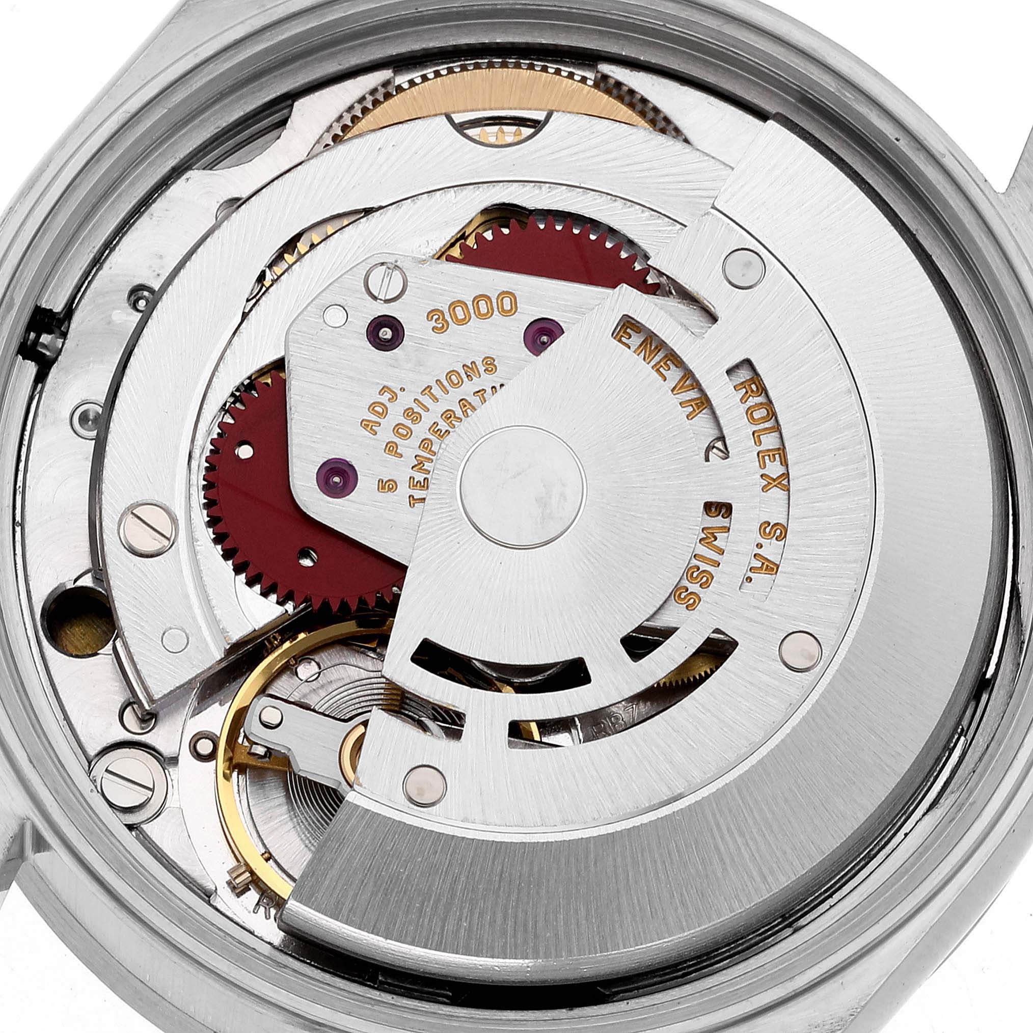 The image shows the movement mechanism of a Rolex Air-King 14010 Men's Stainless Steel Blue Dial 14010 Men's Stainless Steel Blue Dial watch, viewed from the back with visible gears and engravings.