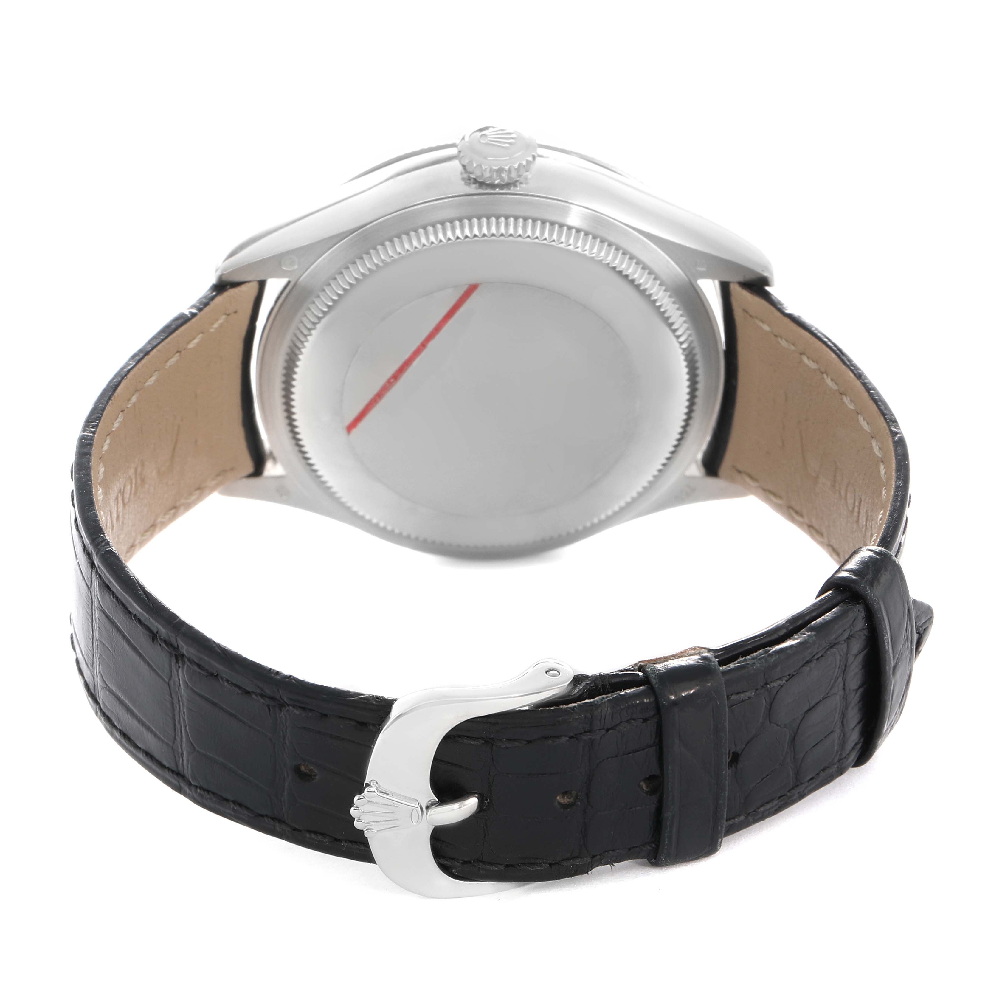 The Rolex Cellini 50519 Men's White Gold Black Dial watch is shown from the back, displaying its caseback, crown, and leather strap with a buckle.