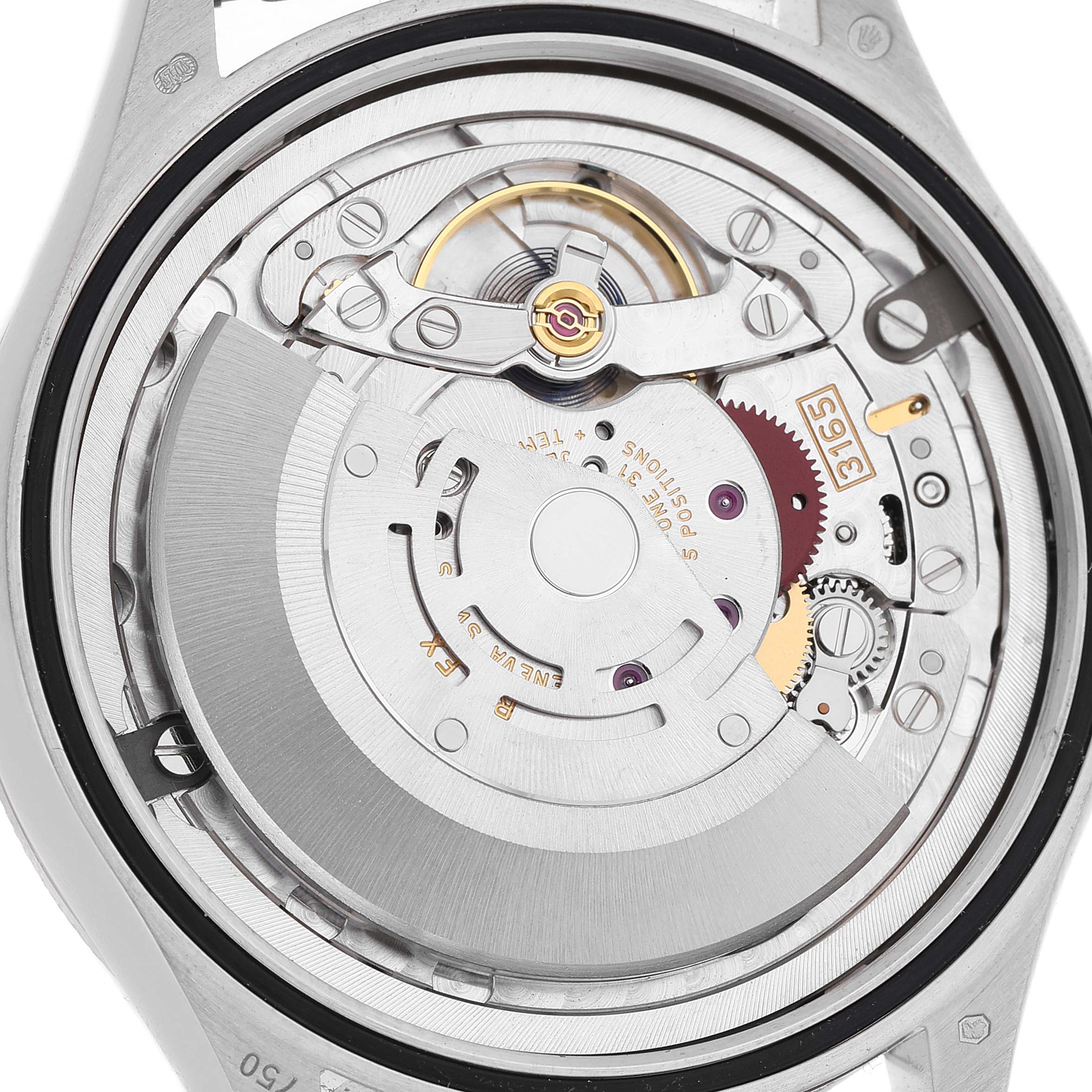 The angle shows the intricate inner mechanism of a Rolex Cellini 50519 Men's White Gold Black Dial watch, highlighting gears and the movement components.