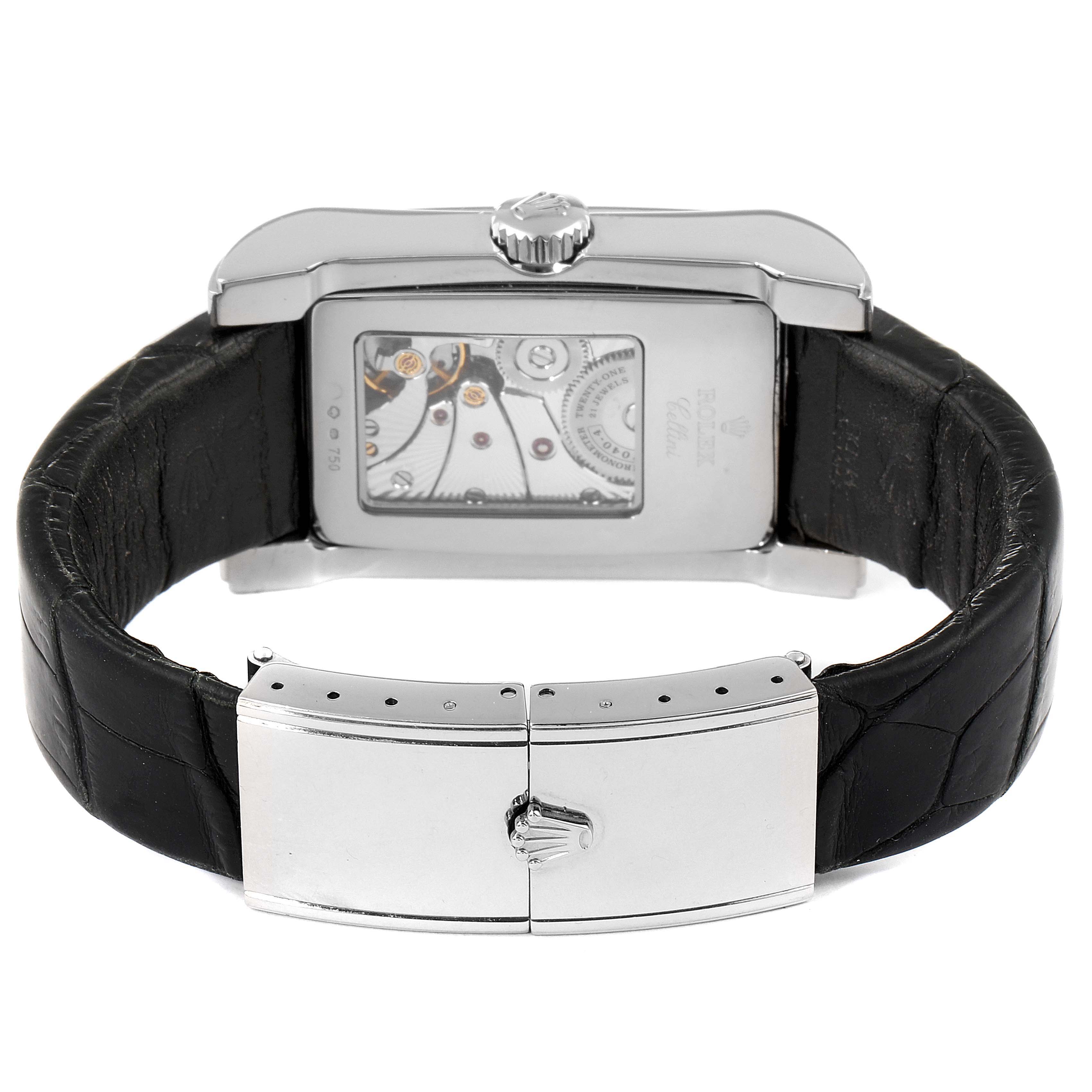 The image shows the back view of a Rolex Cellini 5443/9 Men's White Gold Black Dial 5443/9 Men's White Gold Black Dial watch, showcasing its leather strap, clasp, and transparent case back.
