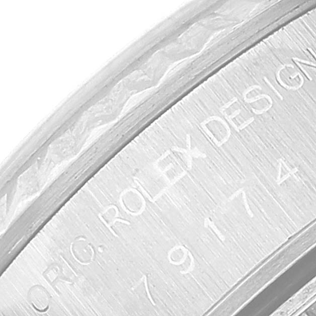 This image shows a close-up view of the engraved inner bezel of a Rolex Datejust 79174 Women's Stainless Steel Silver Dial 79174 Women's Stainless Steel Silver Dial watch.