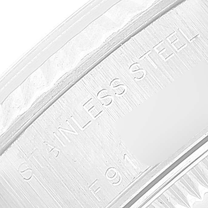 The image shows a close-up angle of the stainless steel casing and serial number of a Rolex Datejust 79174 Women's Stainless Steel Silver Dial 79174 Women's Stainless Steel Silver Dial watch.