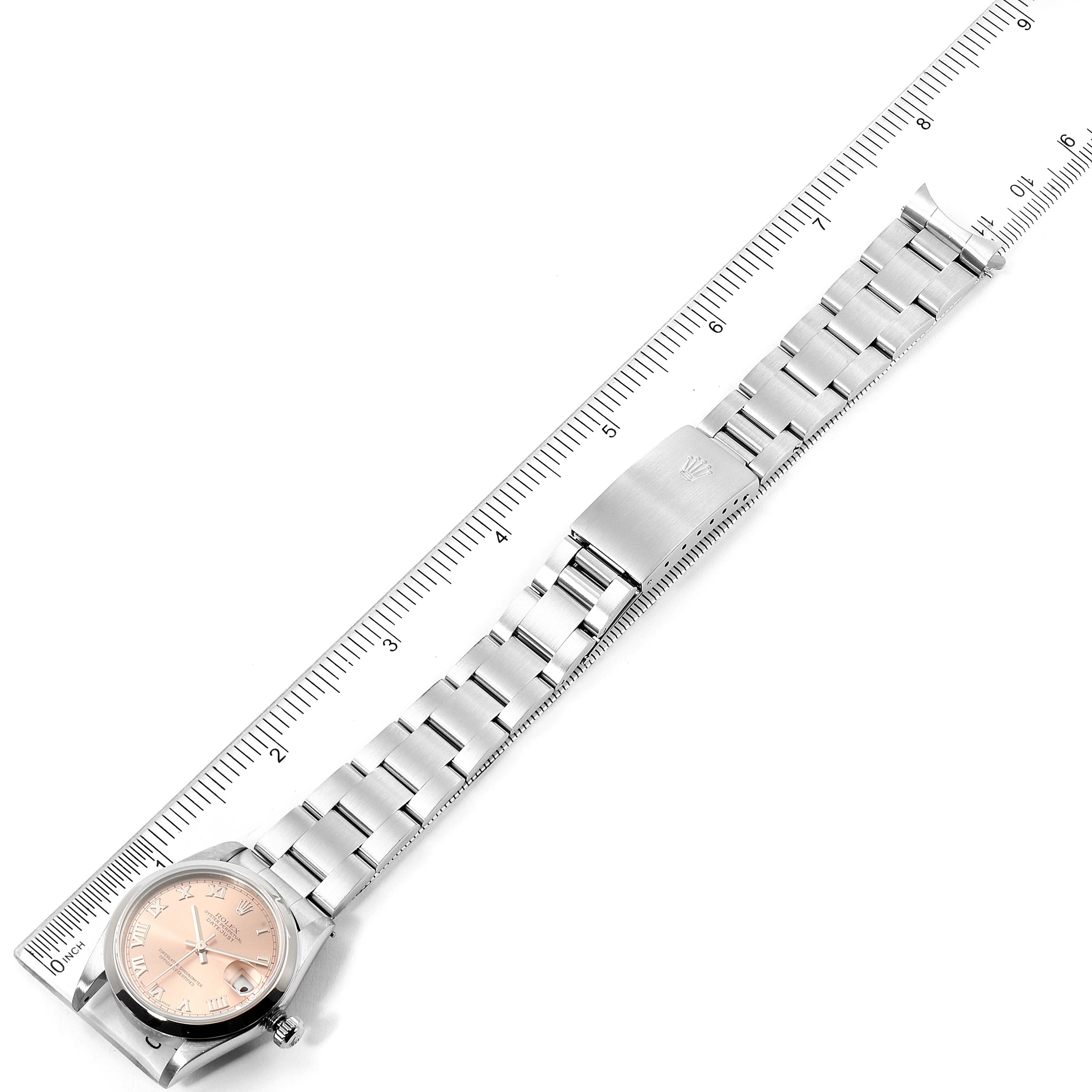 The image shows a Rolex Mid-Size 78240 Women's Stainless Steel Pink Dial 78240 Women's Stainless Steel Pink Dial model watch placed flat with its bracelet, case, and ruler measuring the length.