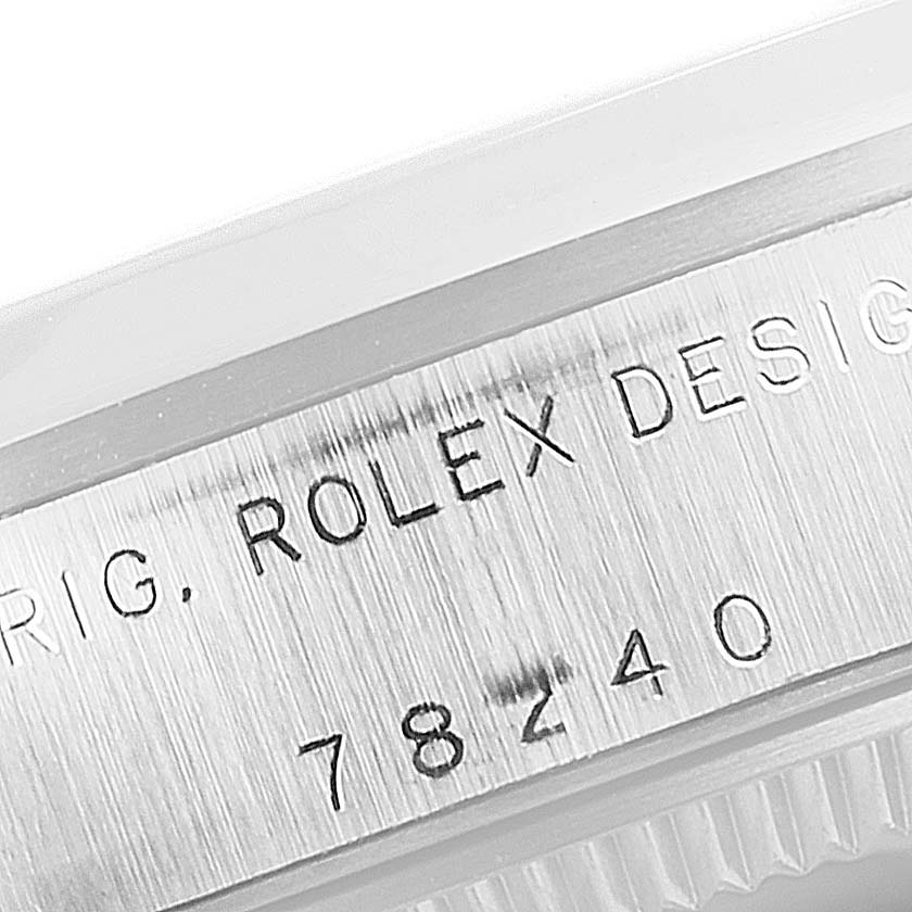 The image shows a close-up of the case side of a Rolex Mid-Size 78240 Women's Stainless Steel Pink Dial 78240 Women's Stainless Steel Pink Dial model, displaying the engraving with "ROLEX DESIGN" and the model number "78240."