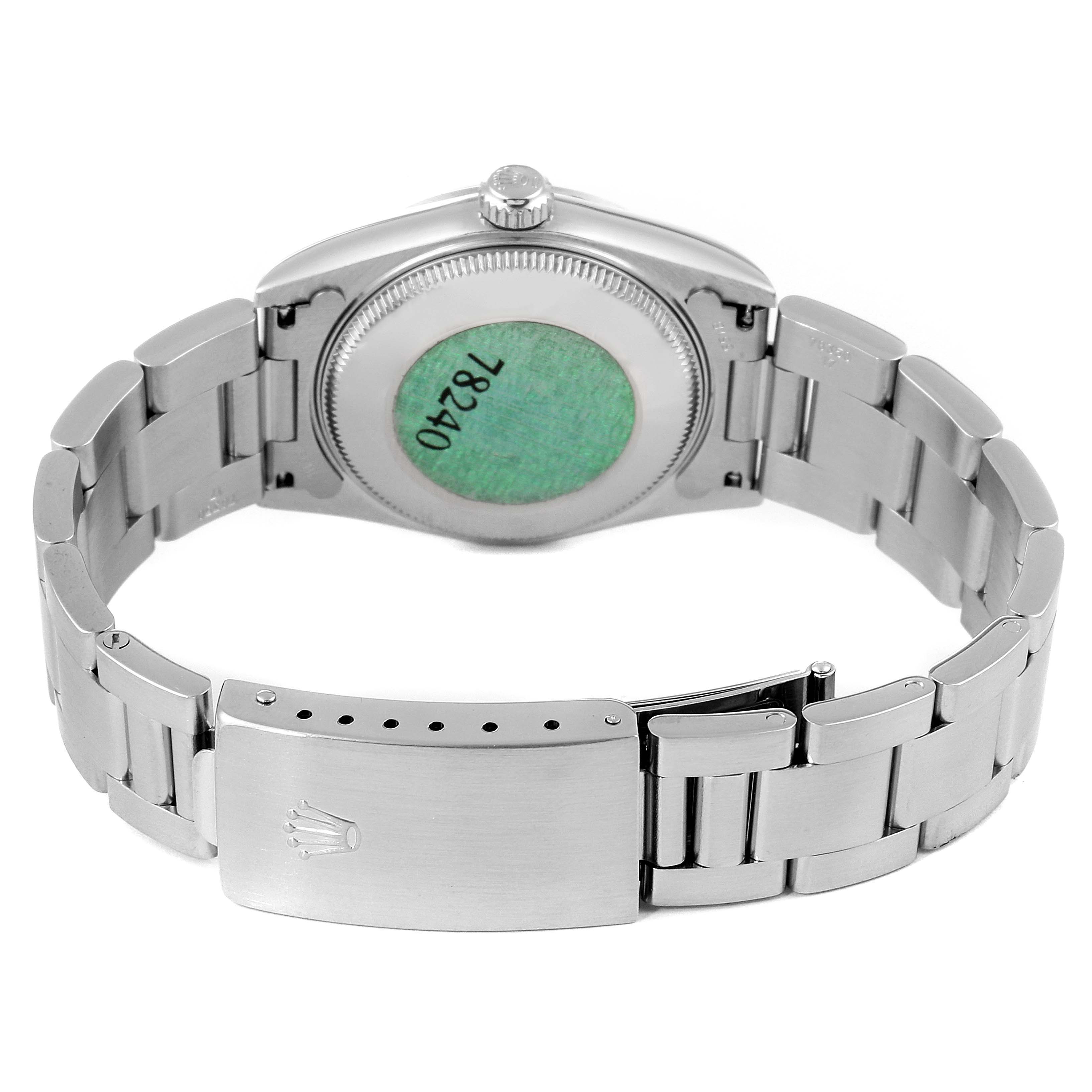 The image shows the back angle of a Mid-Size Rolex watch, displaying the case back, bracelet, and clasp.