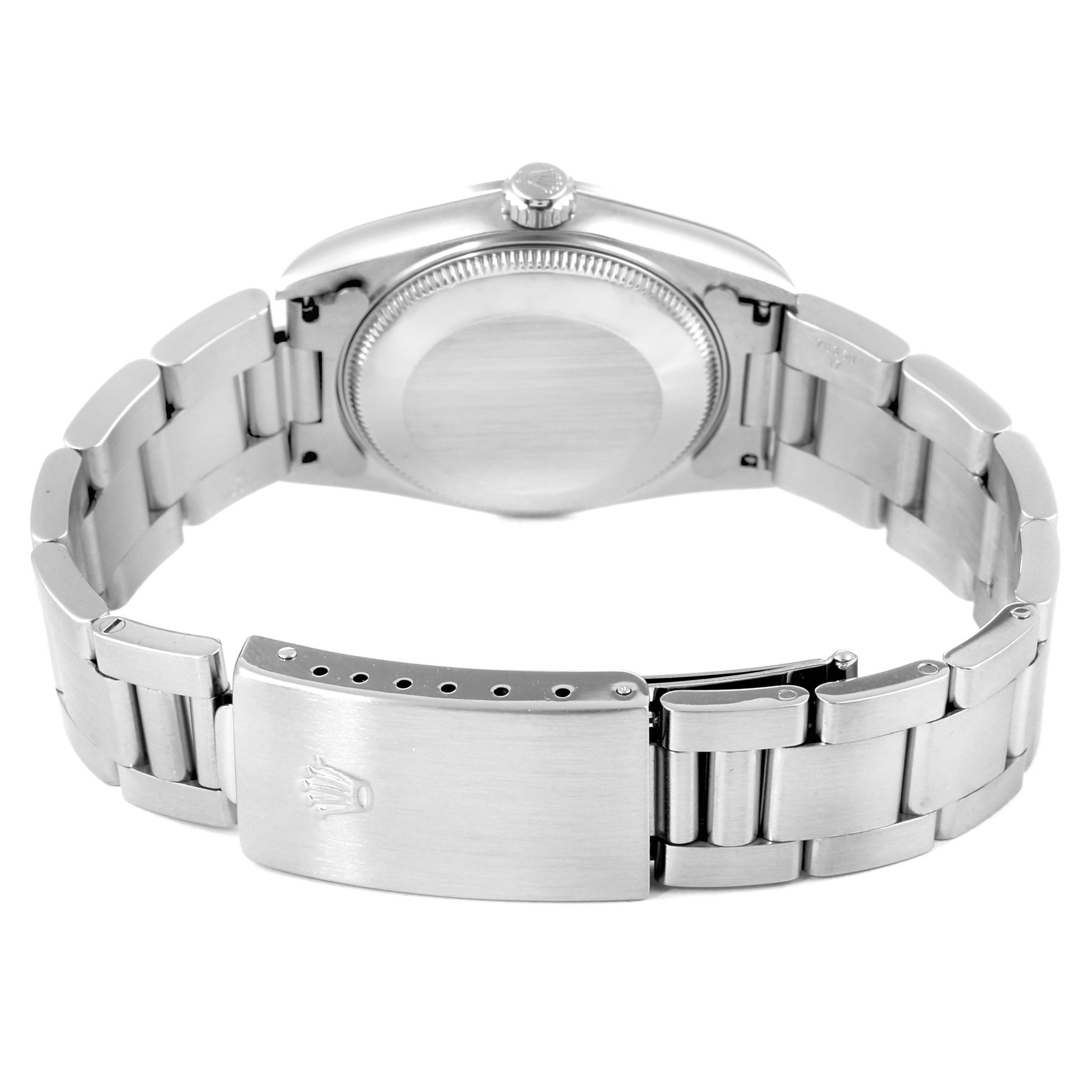 This image shows the back view of a Mid-Size Rolex watch, including its closed clasp and bracelet.