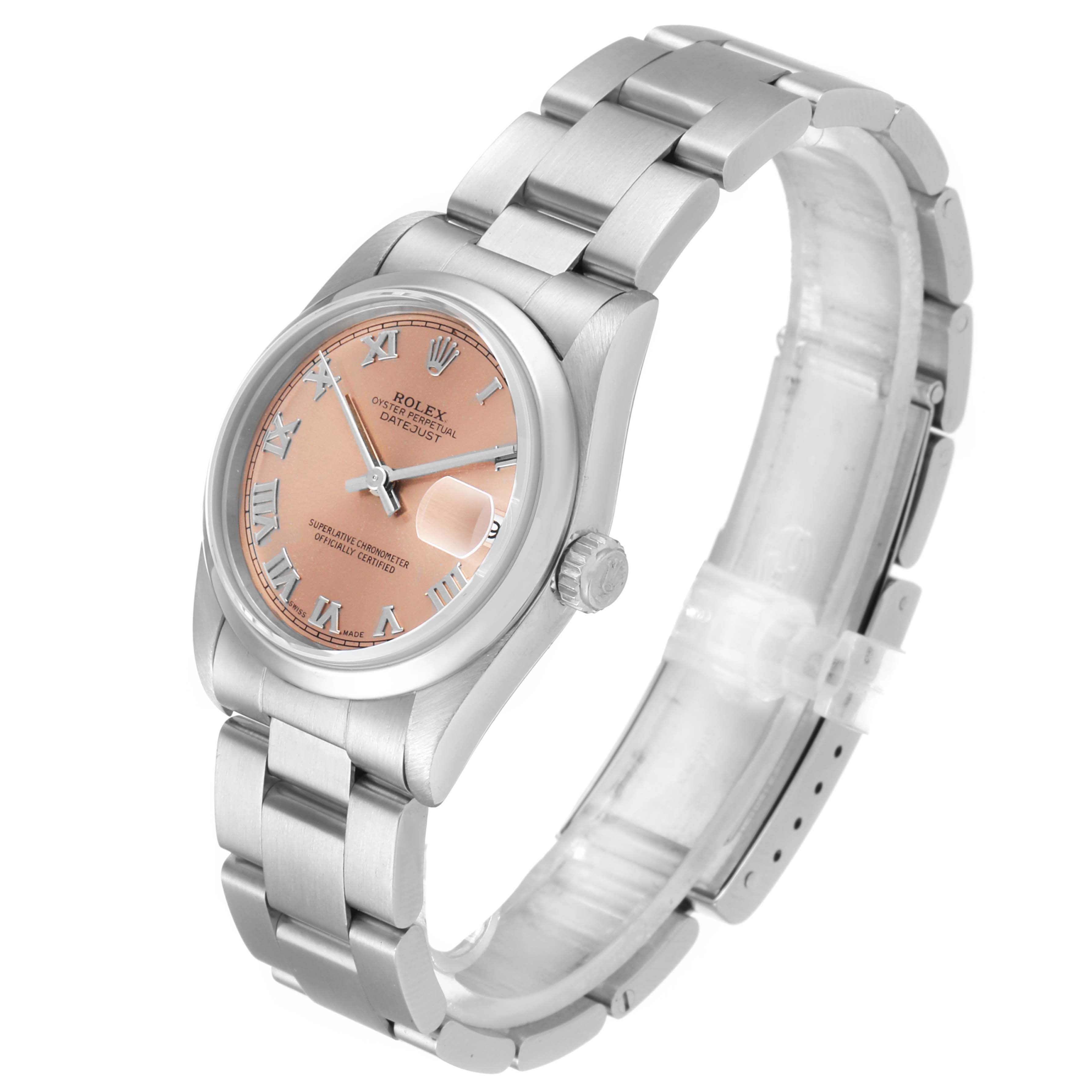 The image shows a mid-size Rolex watch from a three-quarter angle, displaying the face, crown, and partially open steel bracelet.