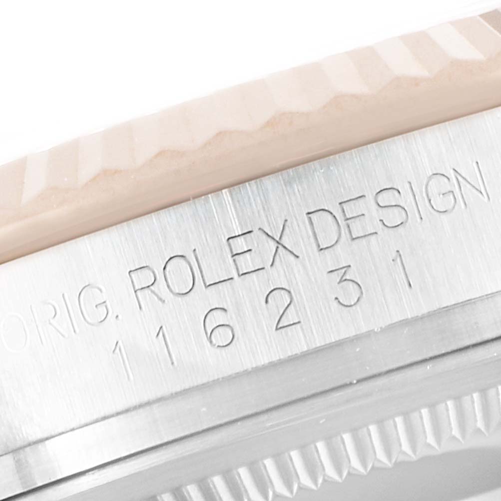 The image shows a close-up of the side of a Rolex Datejust 116231 Men's Steel and Gold (two tone) Silver Dial 116231 Men's Steel and Gold (two tone) Silver Dial, highlighting the bezel and model number engraving.