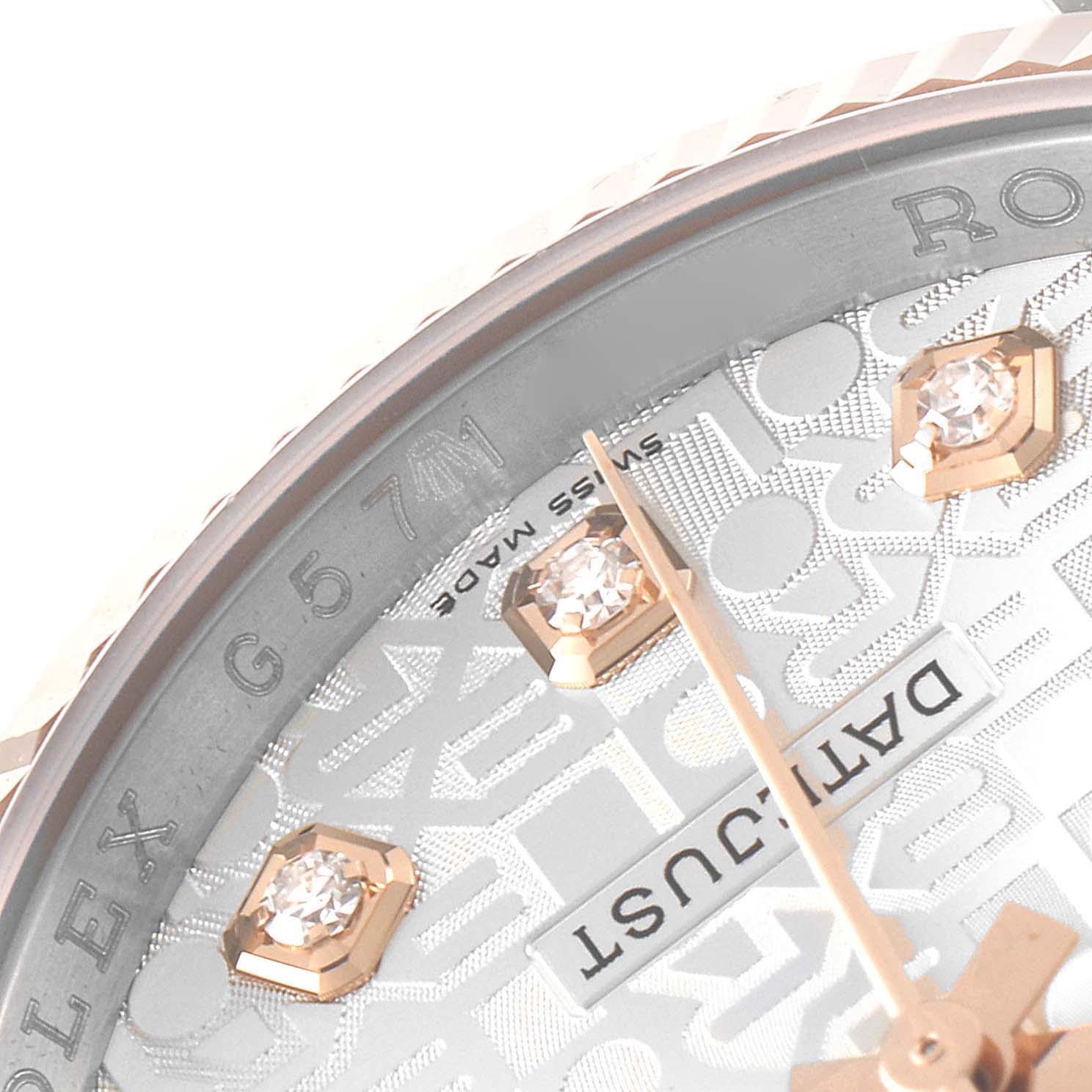 This close-up image of a Rolex Datejust 116231 Men's Steel and Gold (two tone) Silver Dial 116231 Men's Steel and Gold (two tone) Silver Dial watch highlights the bezel, part of the dial, diamond hour markers, and the word "Datejust."