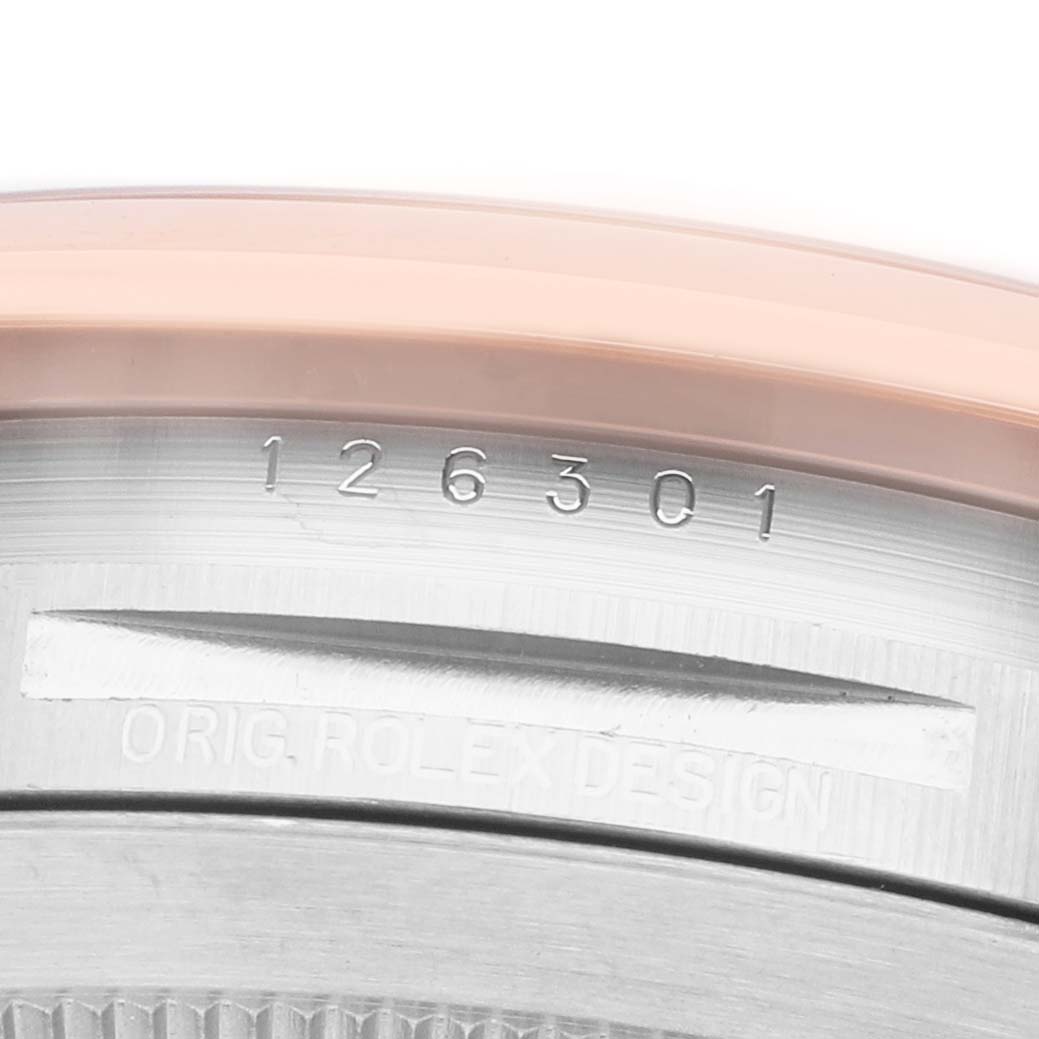 The image shows the side of the Rolex Datejust 41 126301 Men's Steel and Gold (two tone) Grey Dial, focusing on the reference number and "Orig. Rolex Design" engraved on the case.