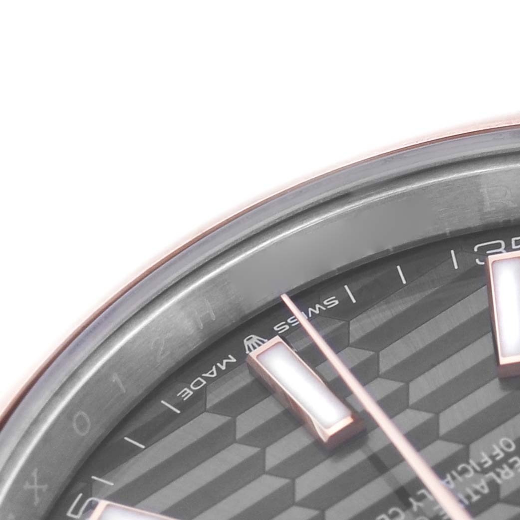 The image shows a close-up of the dial and bezel edge of the Rolex Datejust 41 126301 Men's Steel and Gold (two tone) Grey Dial, highlighting the hour markers and part of the minute track.