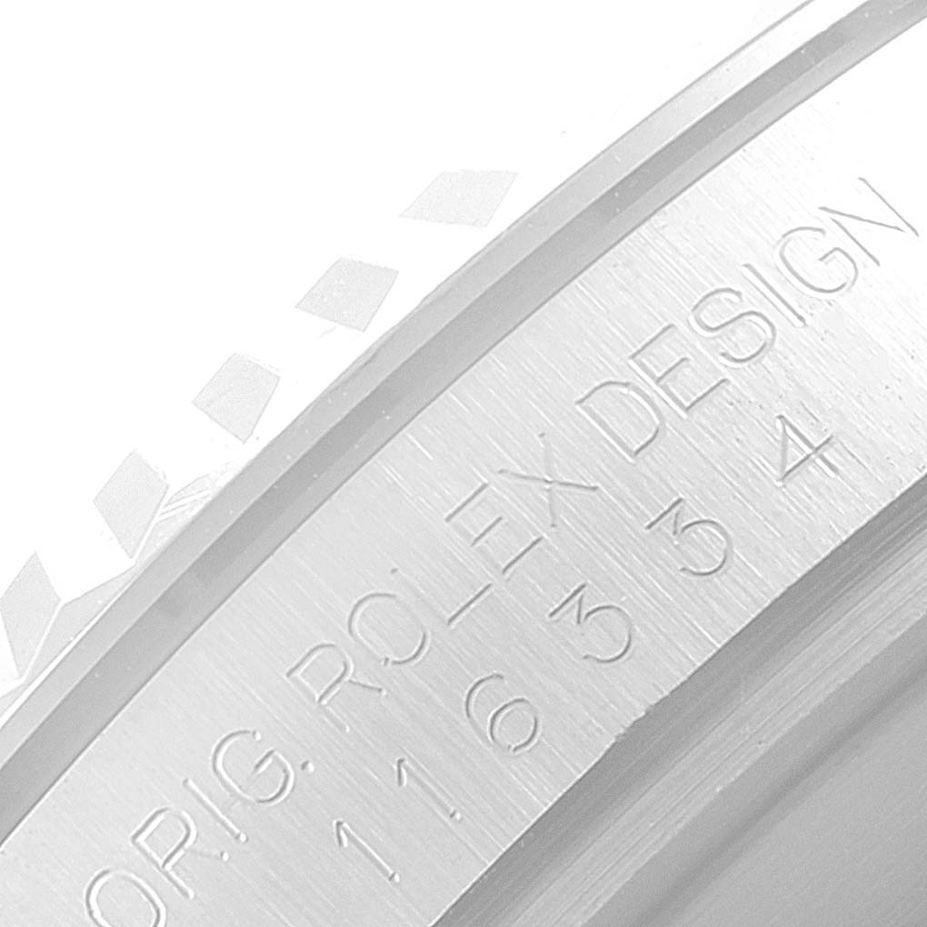 The image shows a close-up of the bezel and case side of the Rolex Datejust 41 116334 Men
s Stainless Steel Grey Dial 116334 Men
s Stainless Steel Grey Dial, highlighting the engravings.