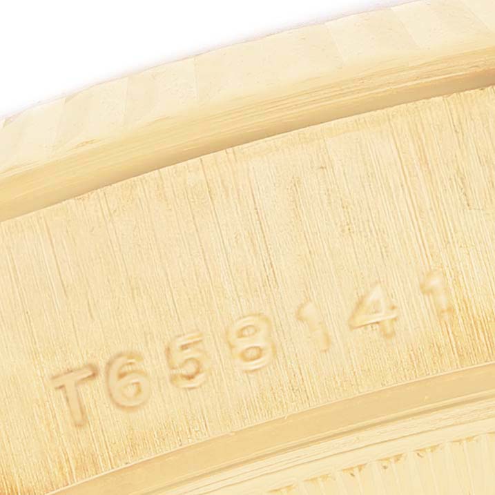 The image shows a close-up of the serial number on the side of a Rolex President 69178 Women's Yellow Gold Mother of Pearl Dial watch case.