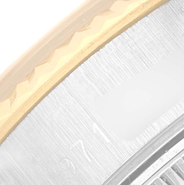 This close-up image shows the fluted bezel and part of the dial of a Rolex Datejust 69173 Women's Steel and Gold (two tone) Champagne Dial 69173 Women's Steel and Gold (two tone) Champagne Dial watch.