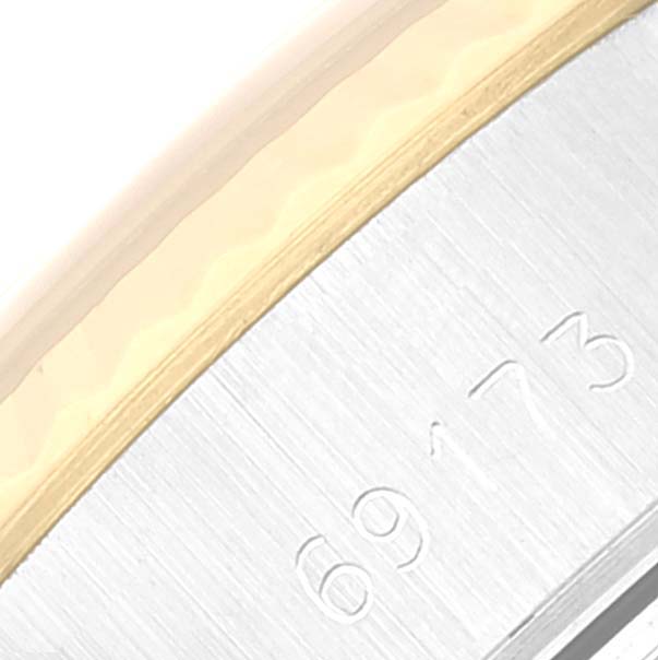 This close-up image shows part of the bezel and case of a Rolex Datejust 69173 Women's Steel and Gold (two tone) Champagne Dial 69173 Women's Steel and Gold (two tone) Champagne Dial watch.
