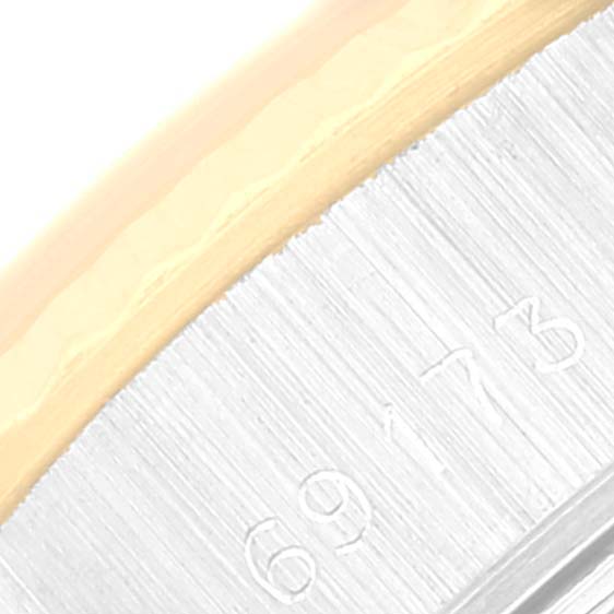 This close-up image shows the bezel and possibly the case number of a Rolex Datejust 69173 Women's Steel and Gold (two tone) Champagne Dial 69173 Women's Steel and Gold (two tone) Champagne Dial watch.
