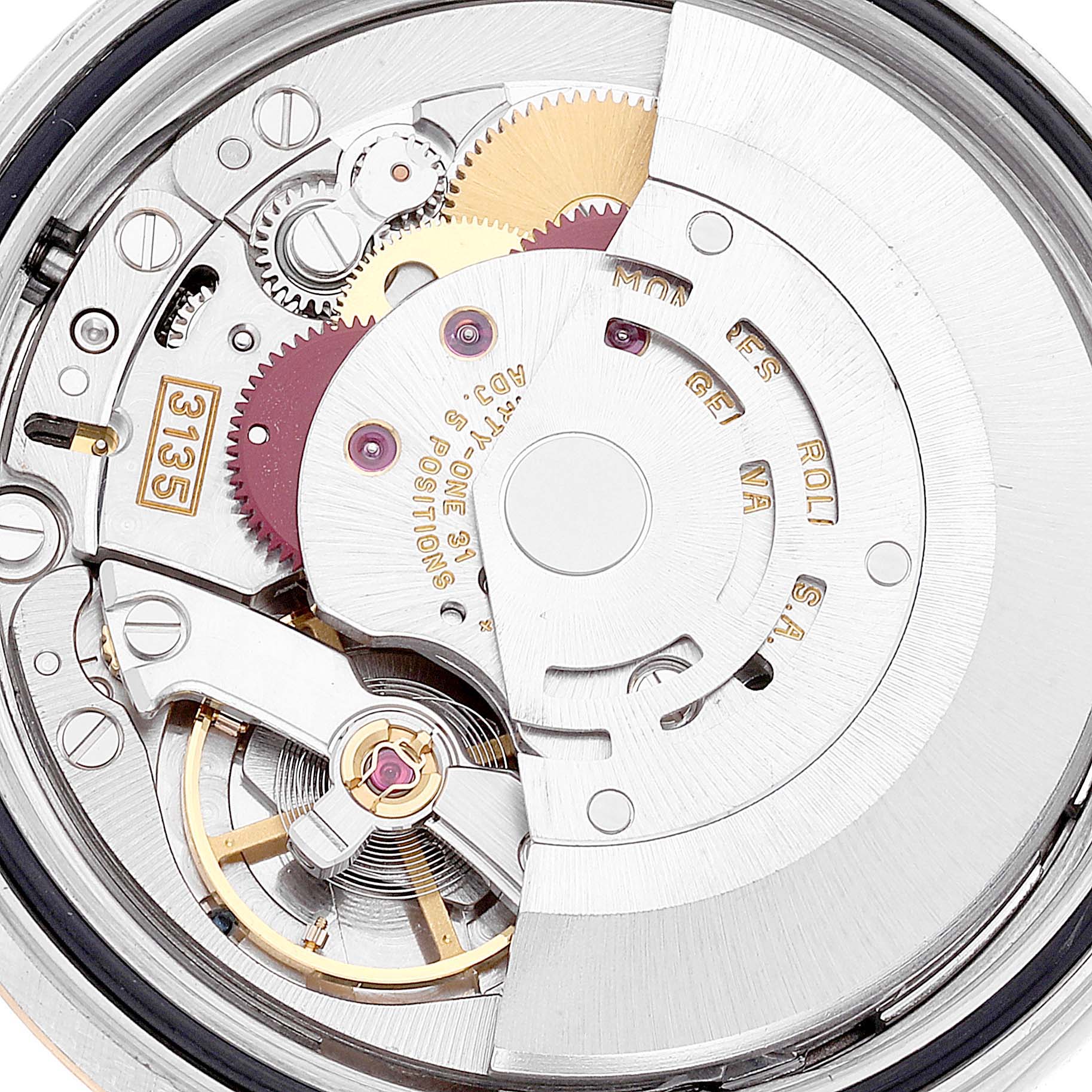 The image shows a close-up of the Rolex Datejust 16233 Men's Steel and Gold (two tone) Silver Dial 16233 Men's Steel and Gold (two tone) Silver Dial watch's internal movement and gears.