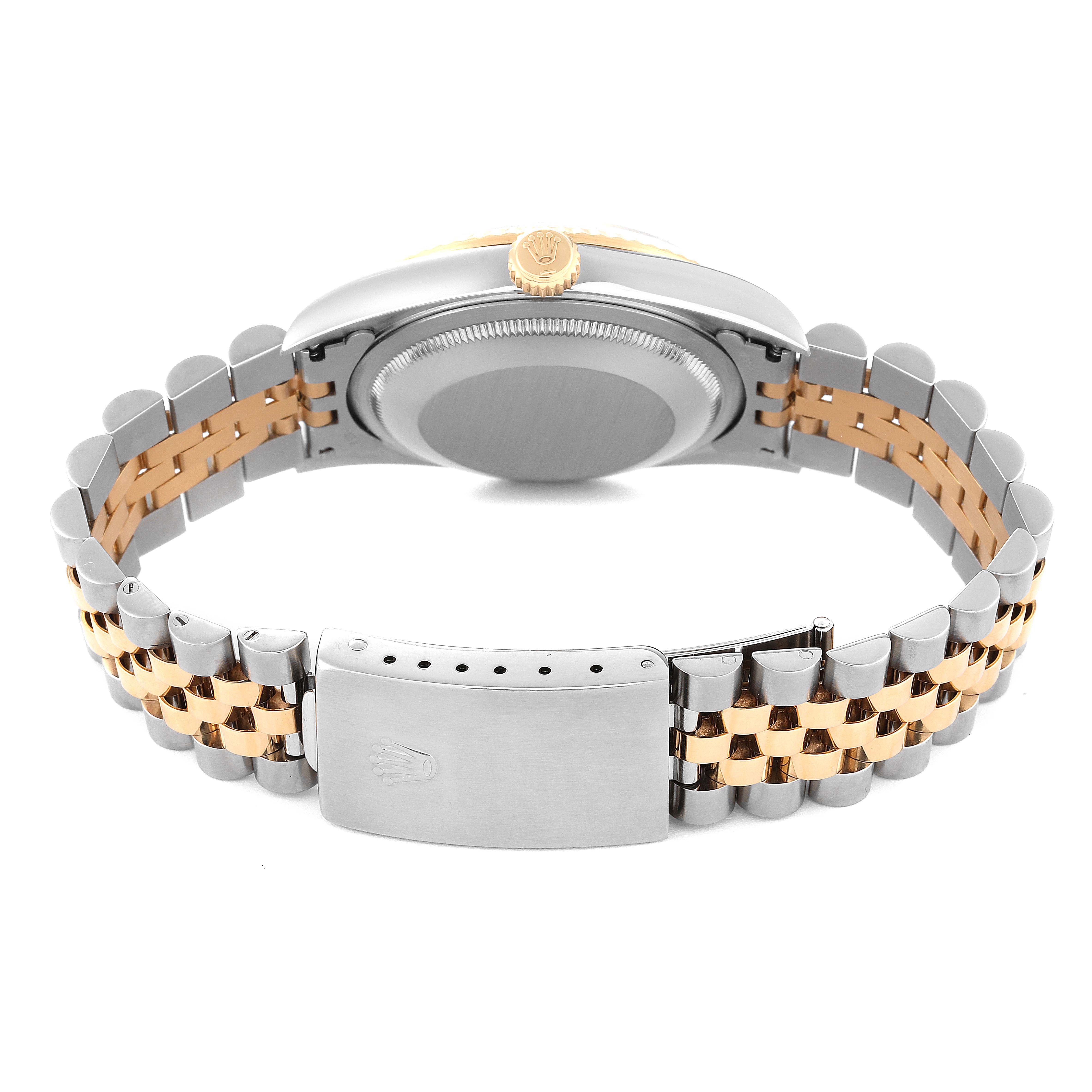 The image shows the back view of a Rolex Datejust 16233 Men's Steel and Gold (two tone) Silver Dial 16233 Men's Steel and Gold (two tone) Silver Dial watch highlighting the bracelet and clasp.