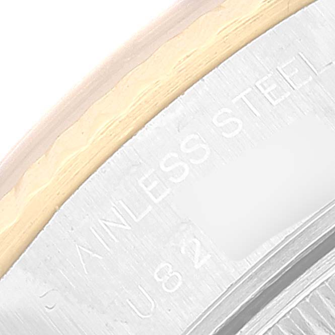 This is a close-up of a Rolex Datejust 69173 Women's Steel and Gold (two tone) Grey Dial 69173 Women's Steel and Gold (two tone) Grey Dial's caseback edge, showing part of the "STAINLESS STEEL" engraving.