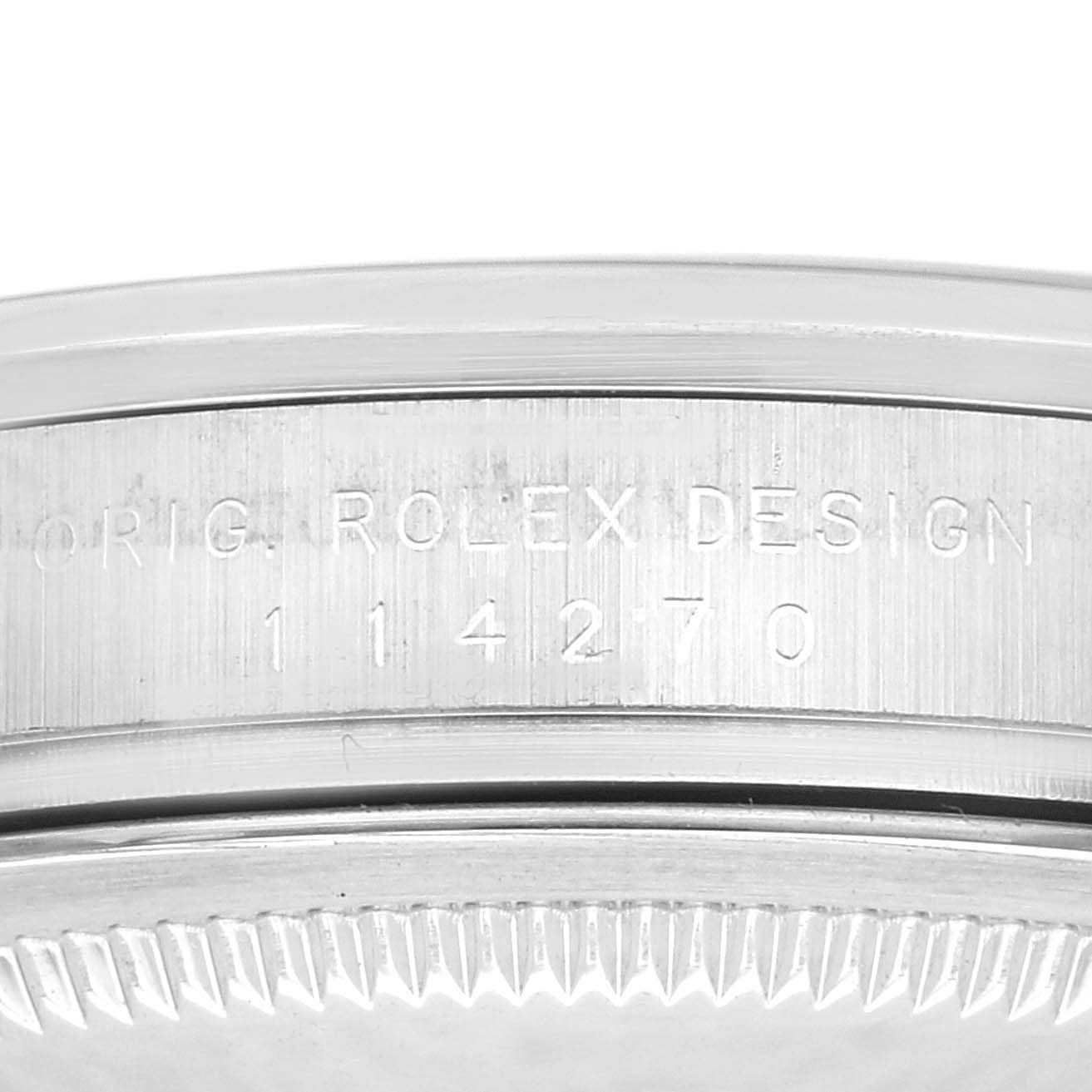 This close-up image of a Rolex Explorer 114270 Men
s Stainless Steel Black Dial 114270 Men
s Stainless Steel Black Dial model shows the case side with engraved design and model number 114270.