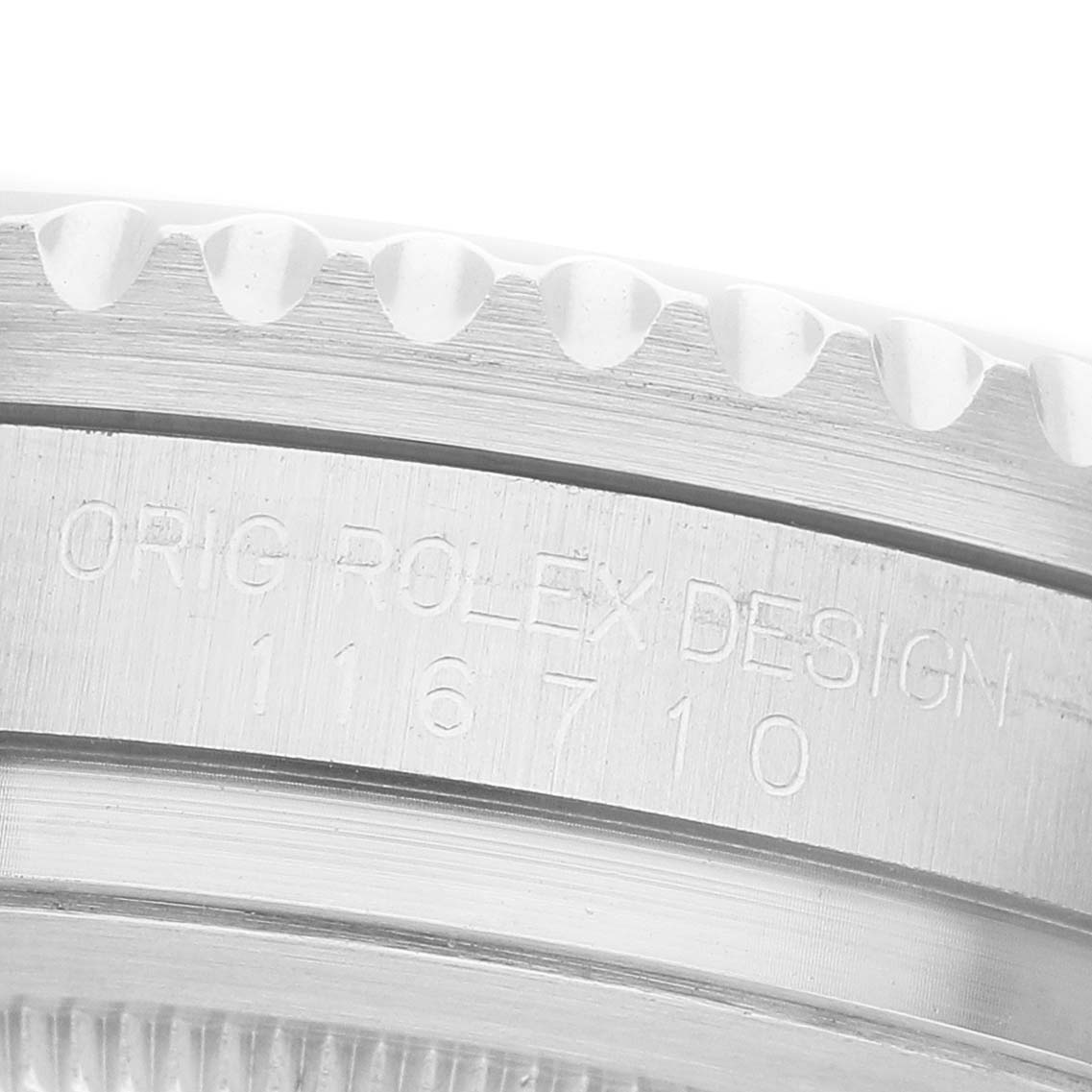 The image shows a close-up of the side of a Rolex GMT-Master 116710BLNR Men's Stainless Steel Black Dial, highlighting the bezel edge and engraved design details.