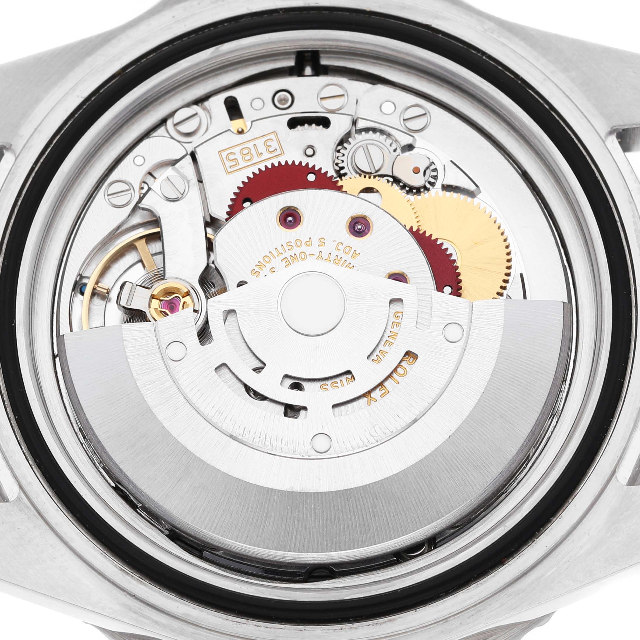 The image shows the movement of a Rolex GMT-Master 16710 Men's Stainless Steel Black Dial watch viewed from the back, highlighting gears and the rotor.