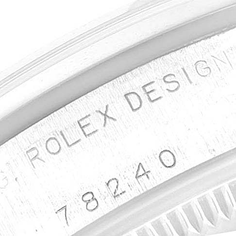 This image shows a close-up of the case side of a Rolex Mid-Size 78240 Women
s Stainless Steel White Dial 78240 Women
s Stainless Steel White Dial model, highlighting the "ROLEX DESIGN" engraving and the model number 78240.