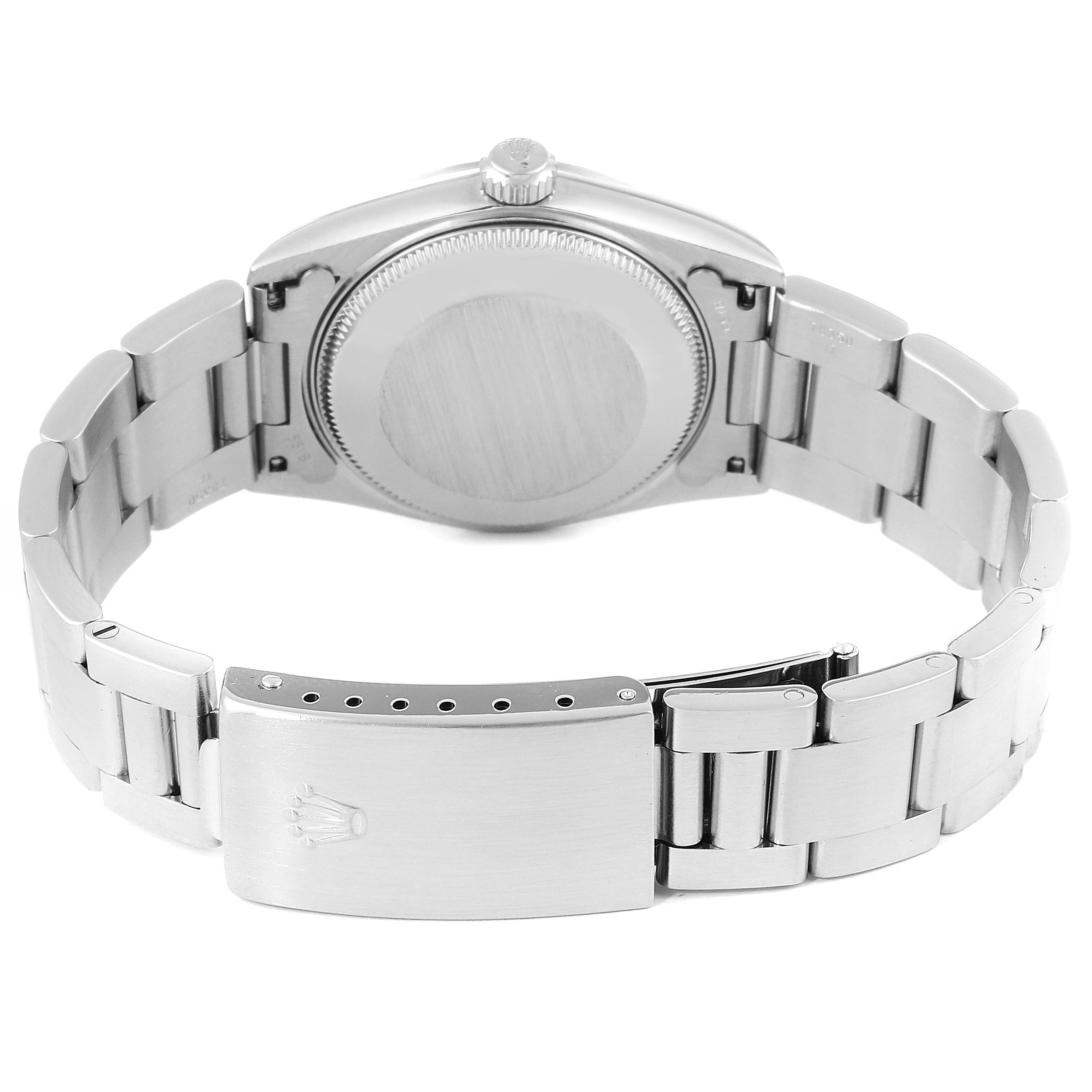 This image shows the back case, crown, and bracelet of a Rolex Mid-Size 78240 Women
s Stainless Steel White Dial 78240 Women
s Stainless Steel White Dial model watch.