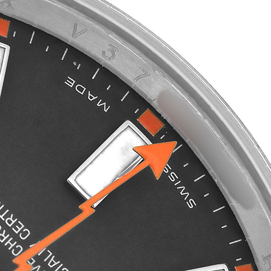 The image shows a close-up of the dial edge, orange second hand, and indices of the Rolex Milgauss 116400 Men's Stainless Steel Black Dial.
