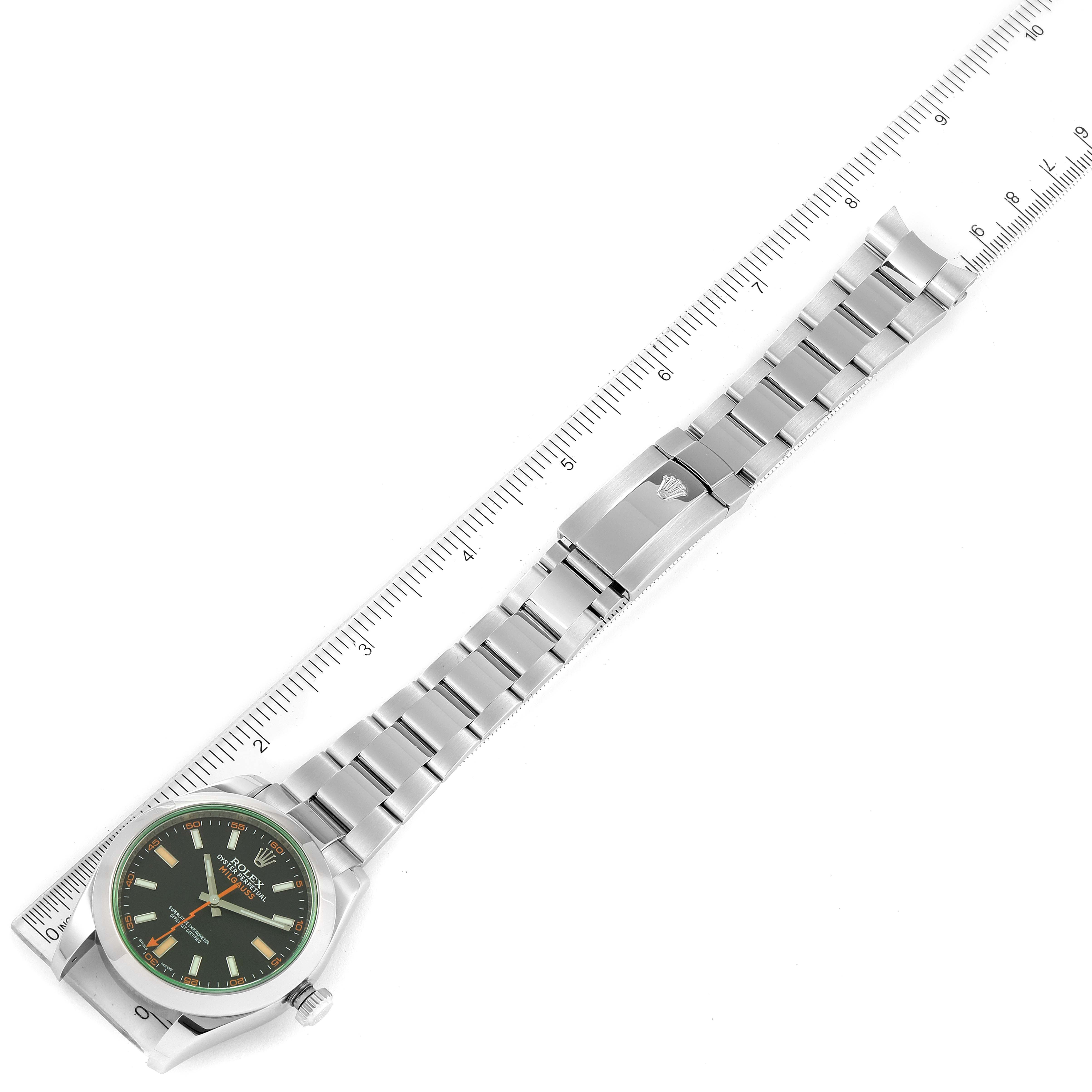 The image shows a top-down view of the watch face and entire bracelet of a Rolex Milgauss 116400V Men
s Stainless Steel Black Dial 116400V Men
s Stainless Steel Black Dial model, alongside a ruler.