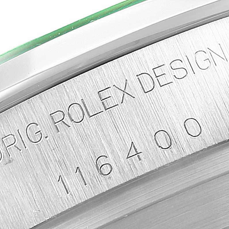 The image shows an angled close-up of the outer edge and serial number of the Rolex Milgauss 116400V Men
s Stainless Steel Black Dial 116400V Men
s Stainless Steel Black Dial model 116400.