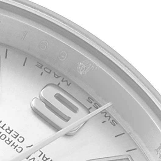The image shows a close-up of the Rolex Oyster Perpetual 176200 Women's Stainless Steel Silver Dial watch face, highlighting the edge, partial numerals, and hands.