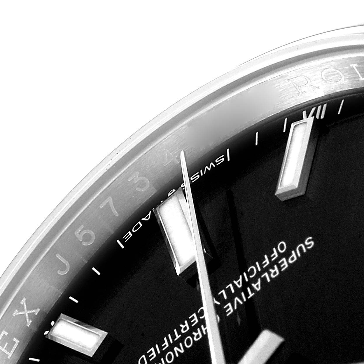 This close-up image of a Rolex Oyster Perpetual 124200 Men's Stainless Steel Black Dial 124200 Men's Stainless Steel Black Dial watch shows the dial, hour markers, and part of the bezel.