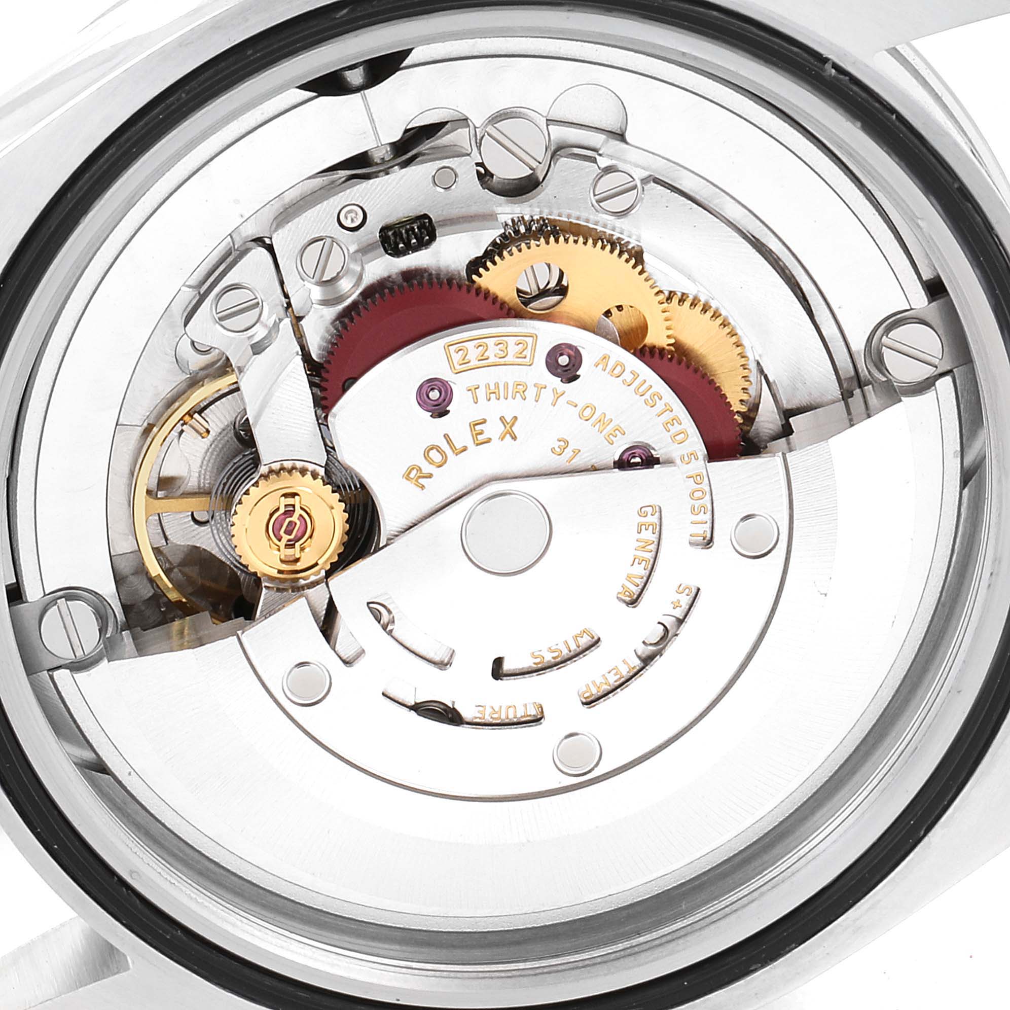 This image shows a close-up of the movement inside a Rolex Oyster Perpetual 124200 Men's Stainless Steel Black Dial 124200 Men's Stainless Steel Black Dial watch, highlighting gears and mechanisms.