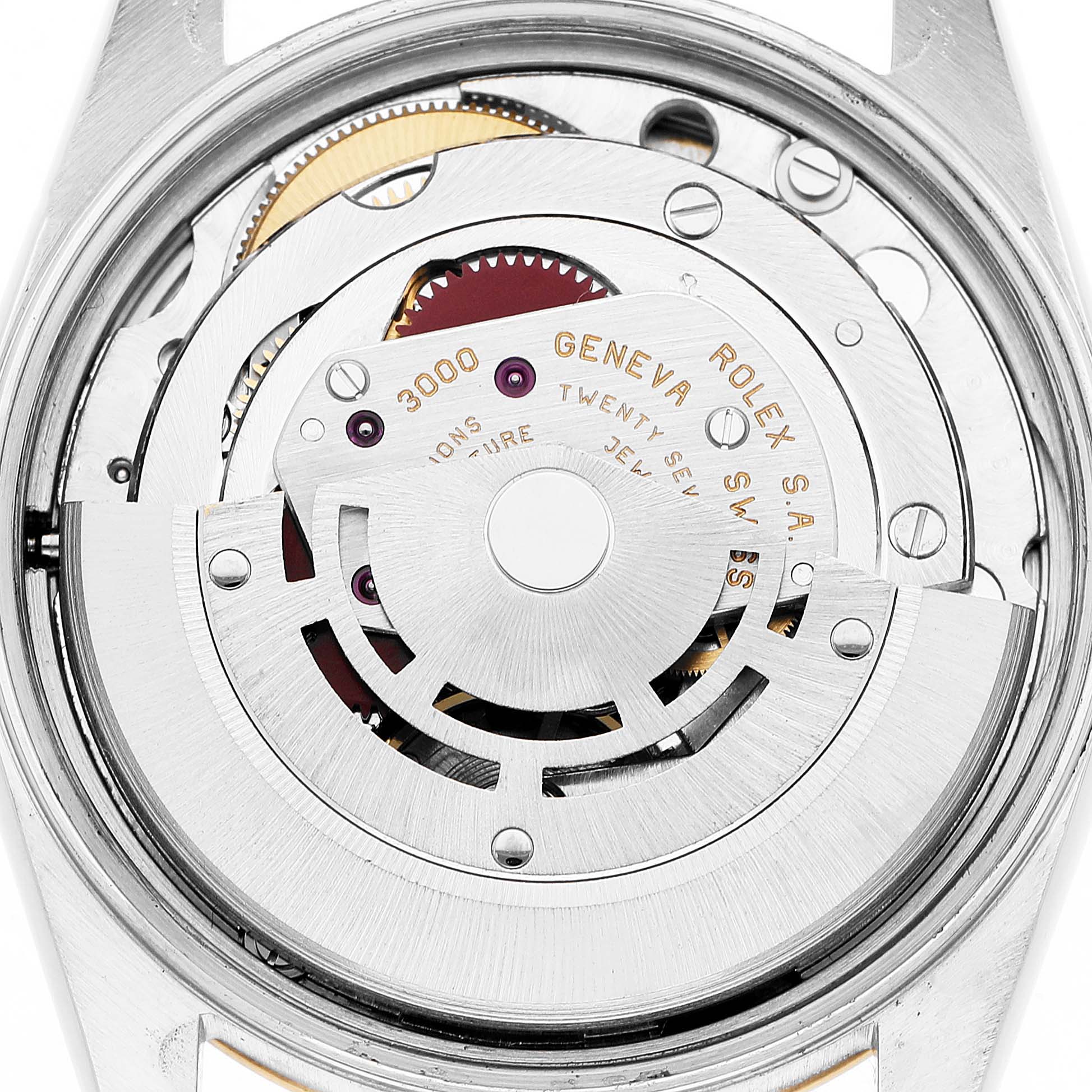 The image shows the movement mechanism of a Rolex Oyster Perpetual 14233 Men's Steel and Gold (two tone) Champagne Dial watch from a top-down angle.