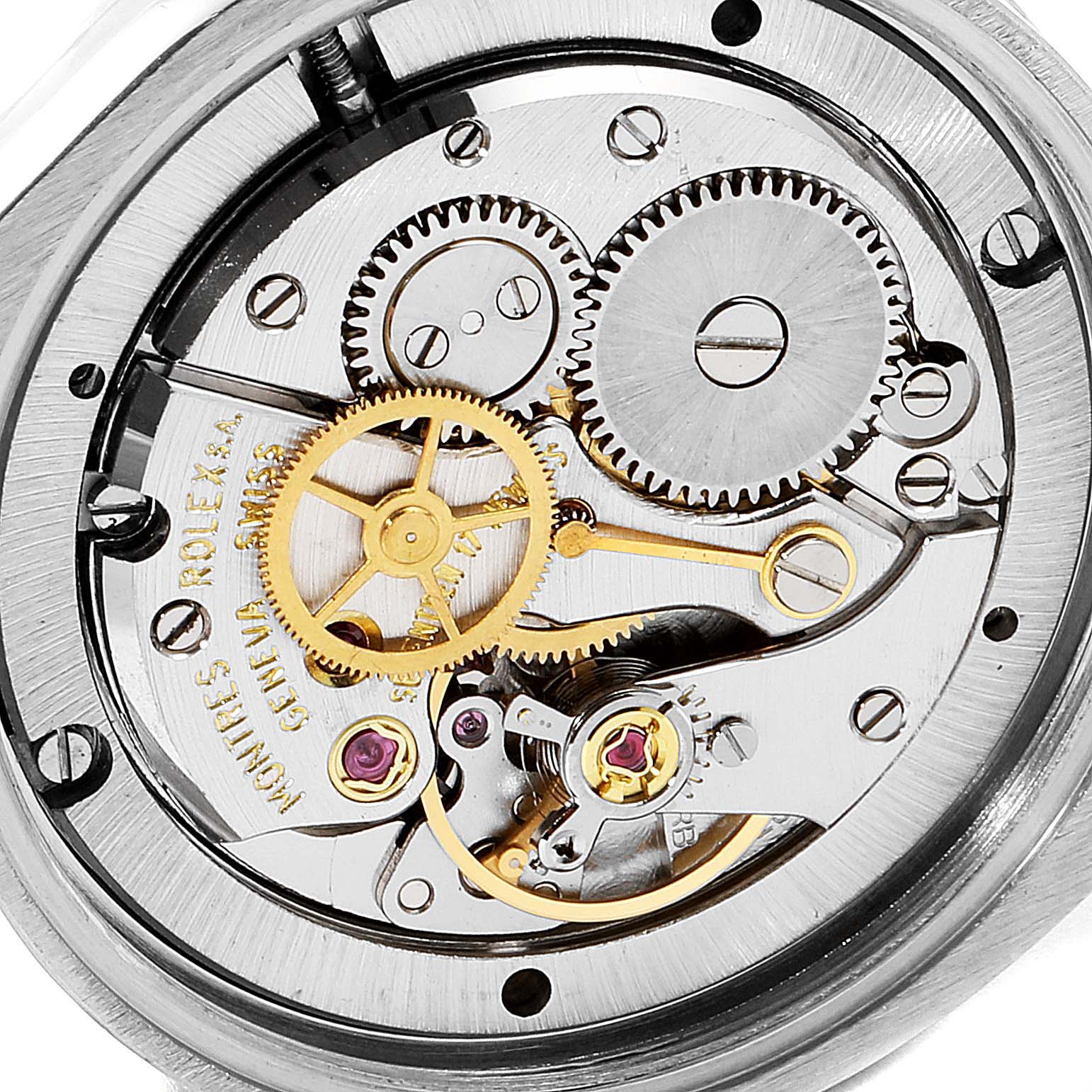 This image shows the inner mechanism of a Vintage Collection Rolex watch, including gears and movement components.