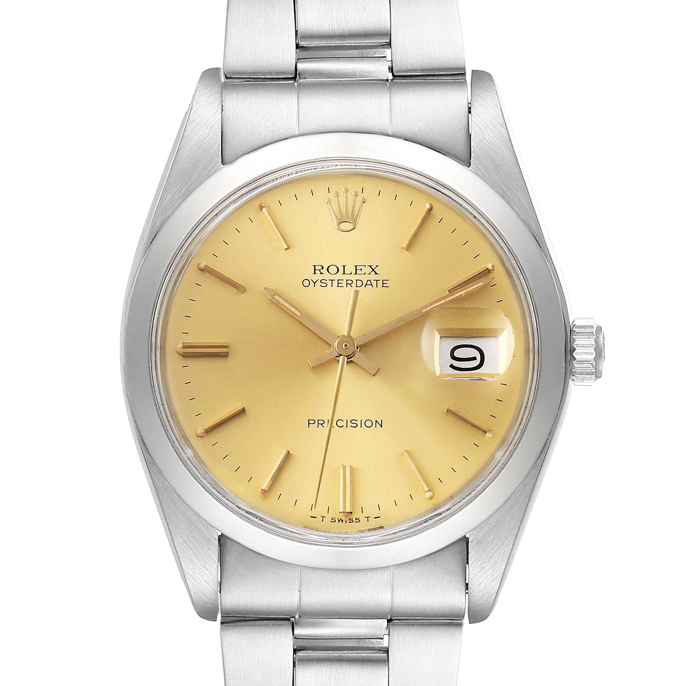 This image shows a Rolex Oysterdate Precision Vintage Collection model watch with a gold dial and silver metal bracelet from a top-front angle.