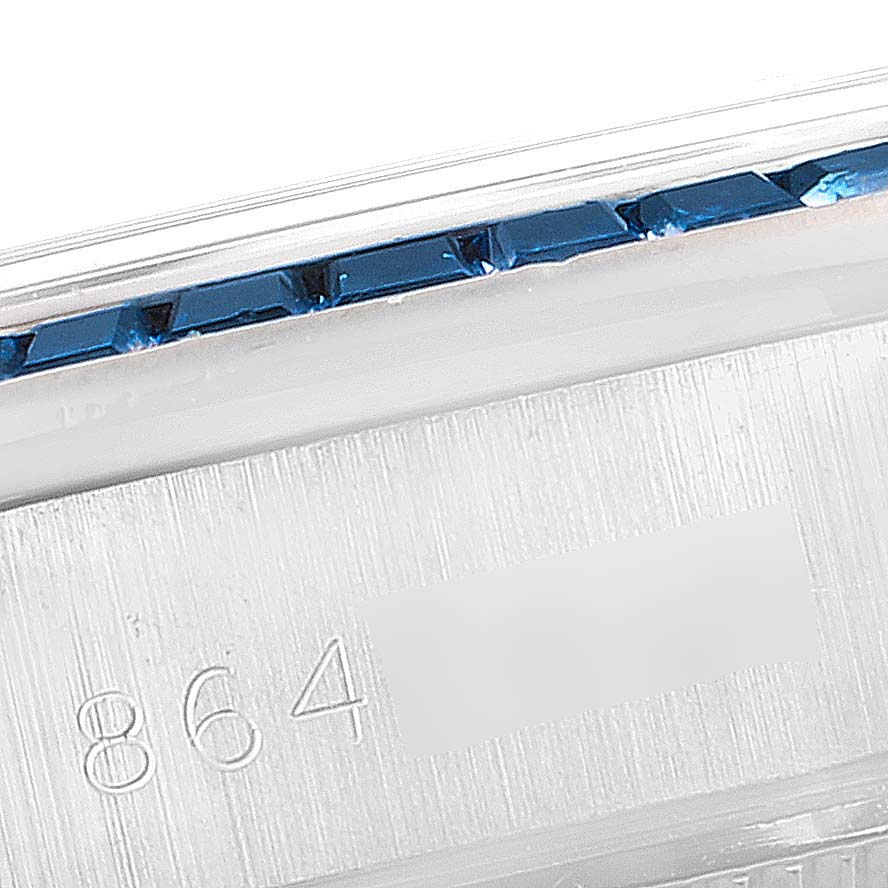 This image shows a close-up of the bezel and serial number engraving of a Rolex President 69119 Women's White Gold Silver Dial 69119 Women's White Gold Silver Dial model watch.