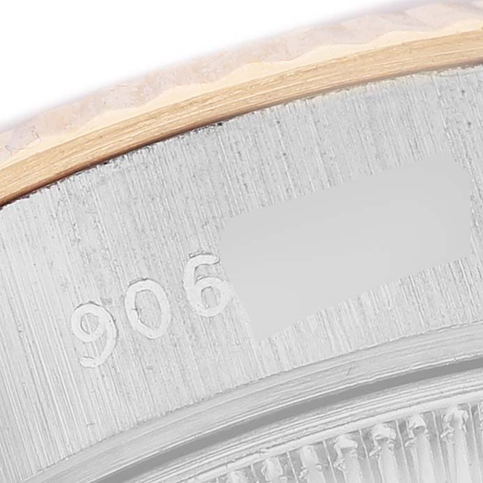 The image shows a close-up of the edge and part of the case back for a Rolex President 69179 Women's White Gold Brown Dial model watch.