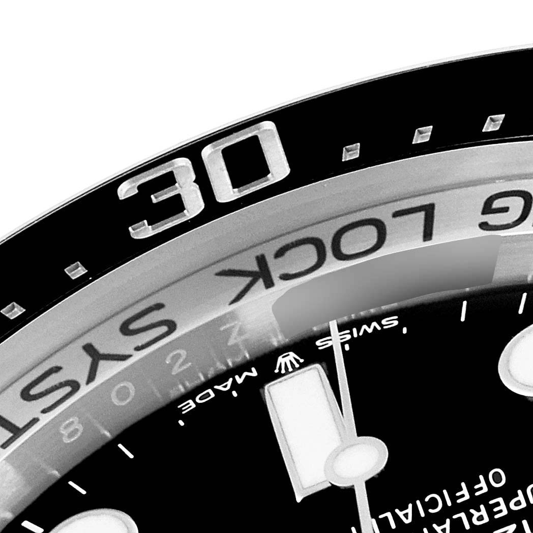 The image shows a close-up of the bezel and part of the dial of a Rolex Sea-Dweller 126660 Men's Stainless Steel Black Dial 126660 Men's Stainless Steel Black Dial.