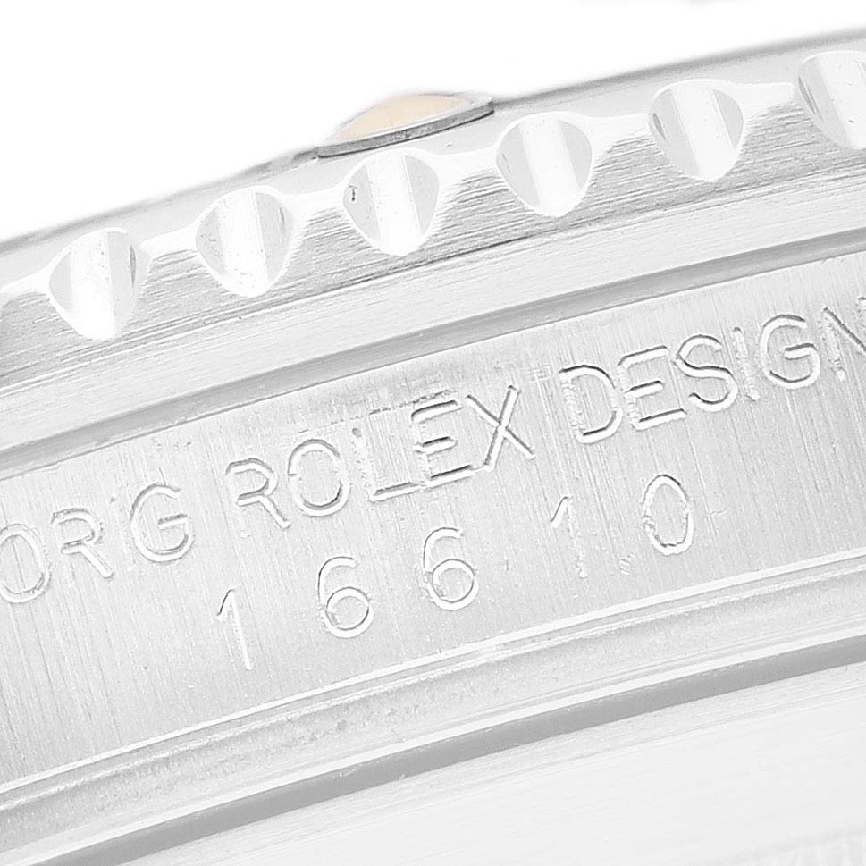 The image shows a close-up of the engraved side of a Rolex Submariner 16610 Men's Stainless Steel Black Dial's bezel, featuring the model number "16610."