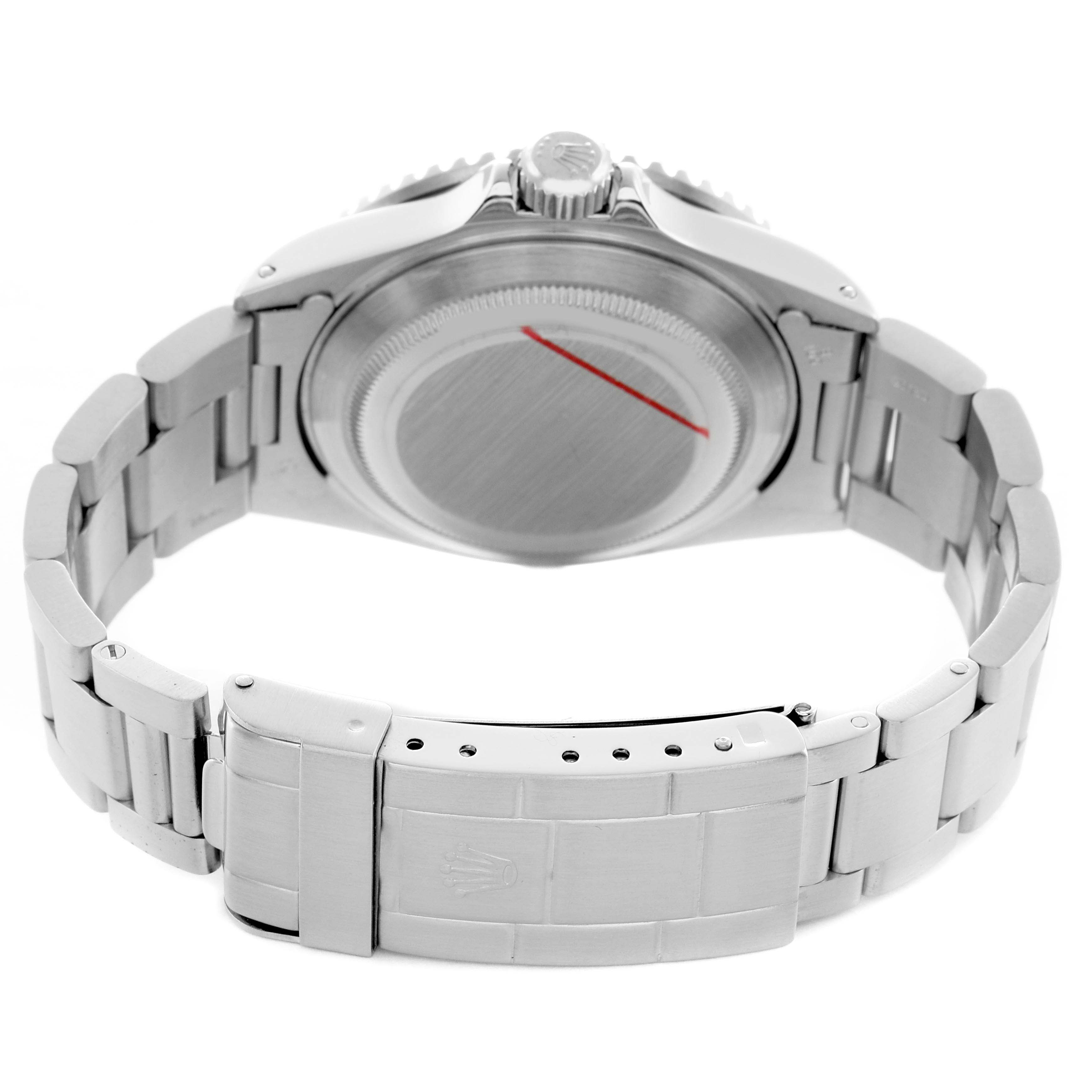 The image shows the backside of a Rolex Submariner 16610 Men's Stainless Steel Black Dial, displaying the case back, crown, and bracelet clasp.