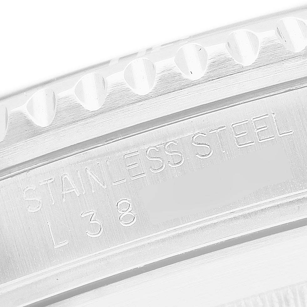 The image shows a close-up of the case edge and engraving on the Rolex Submariner 16610 Men's Stainless Steel Black Dial's stainless steel back.