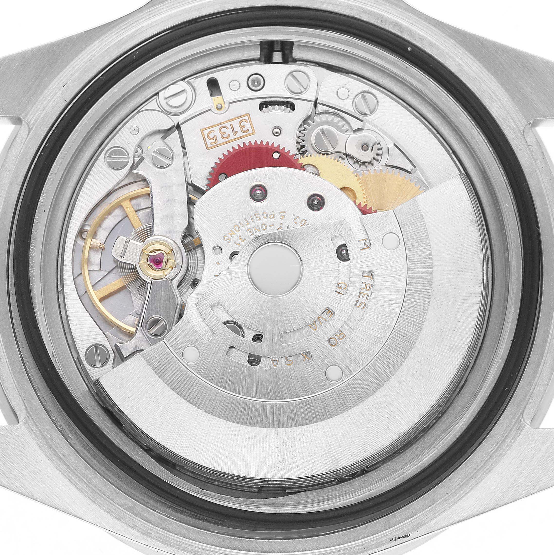 The image shows the movement of a Rolex Submariner 16610 Men's Stainless Steel Black Dial watch from a back view, highlighting its intricate gears and components.