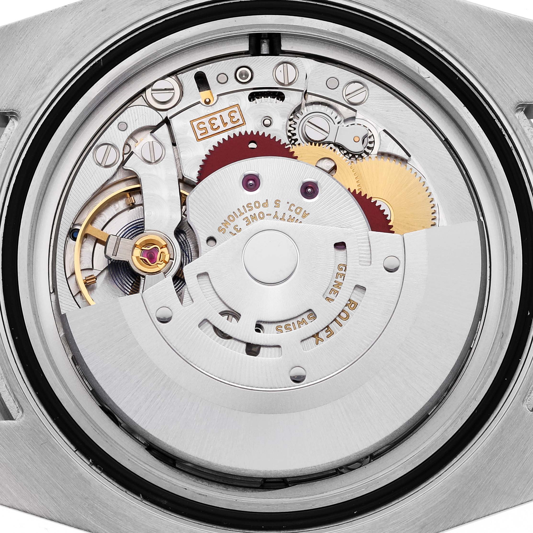 The image shows a close-up view of the Rolex Submariner 116610LV Men's Stainless Steel Green Dial 116610LV Men's Stainless Steel Green Dial's movement from the back, detailing its intricate mechanical components.