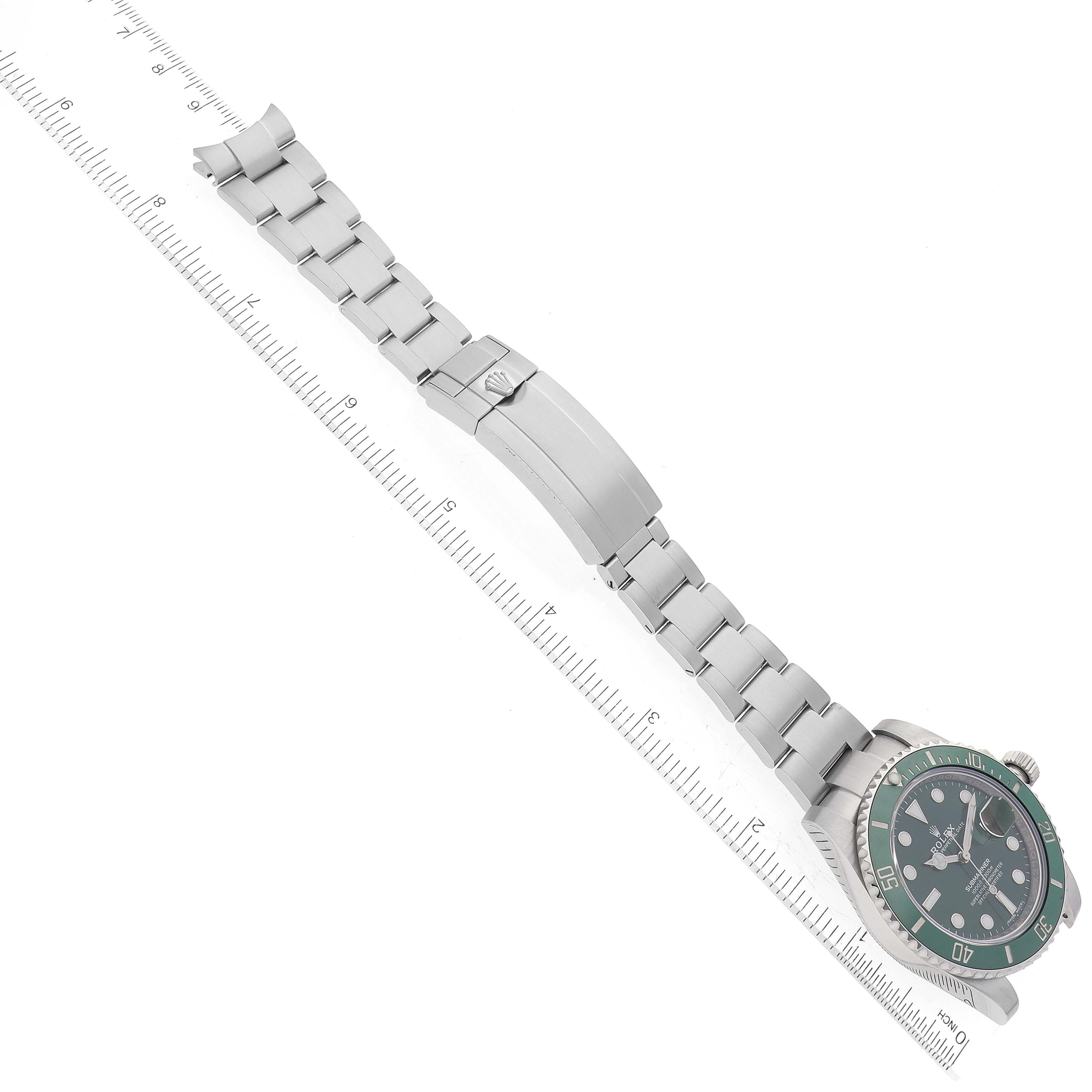 The image shows a Rolex Submariner 116610LV Men's Stainless Steel Green Dial 116610LV Men's Stainless Steel Green Dial watch from an overhead angle, displaying the bracelet, clasp, and part of the dial.