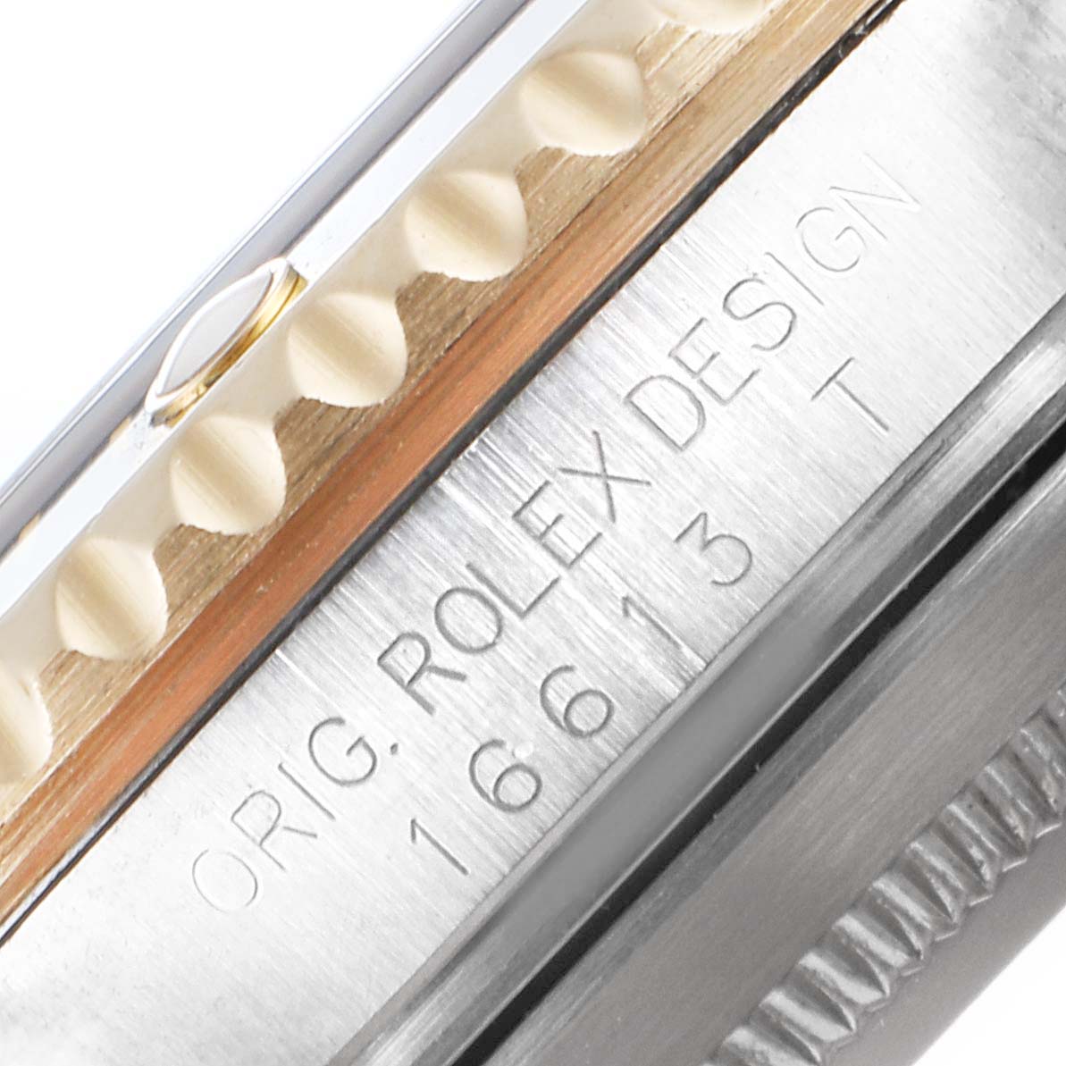 This close-up image of the Rolex Submariner 16613 Men's Steel and Gold (two tone) Black Dial 16613 Men's Steel and Gold (two tone) Black Dial model shows the bezel and engraved case side.