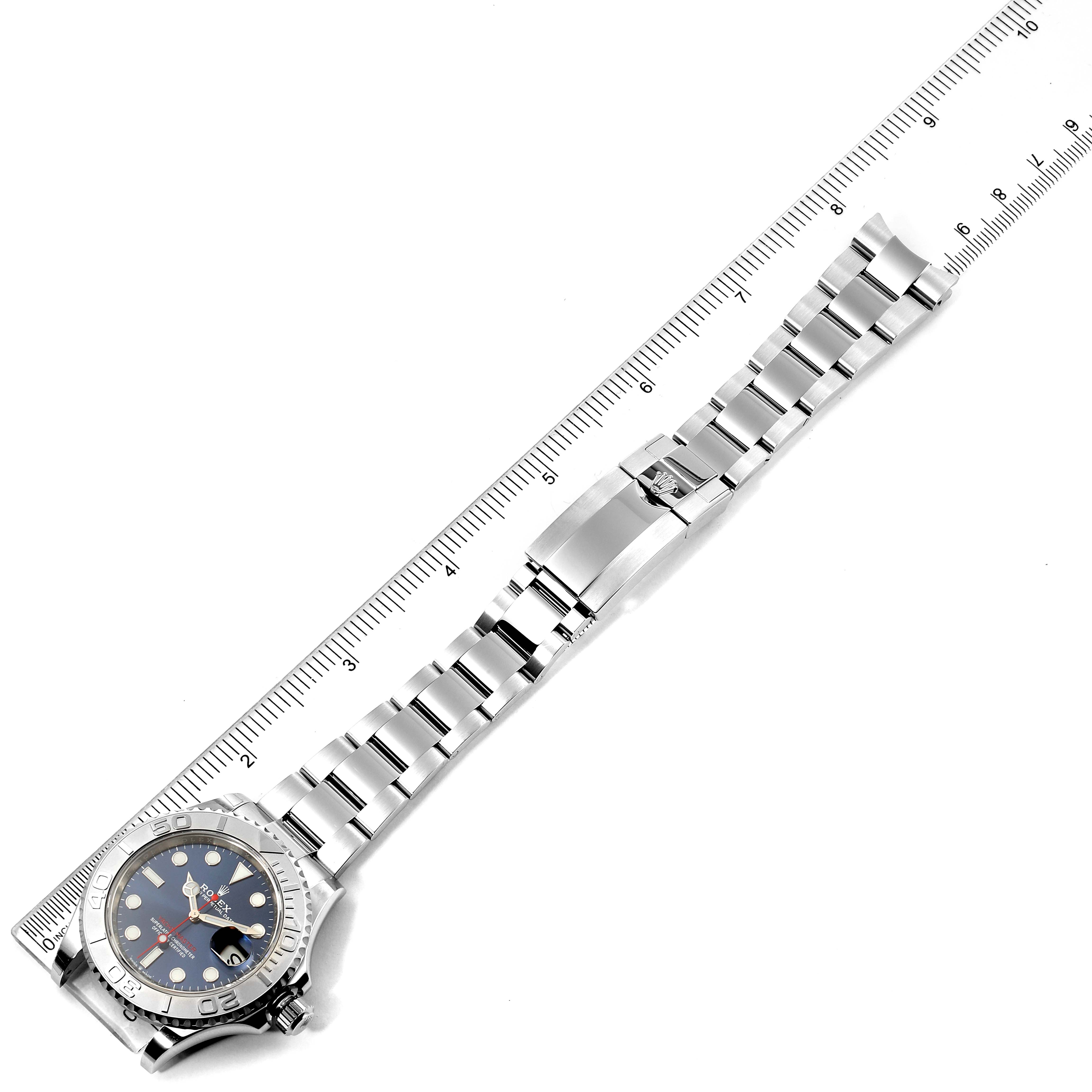 The image shows the full length of a Rolex Yacht-Master 126622 Men's Stainless Steel Blue Dial 126622 Men's Stainless Steel Blue Dial watch with a metal bracelet and ruler for scale.