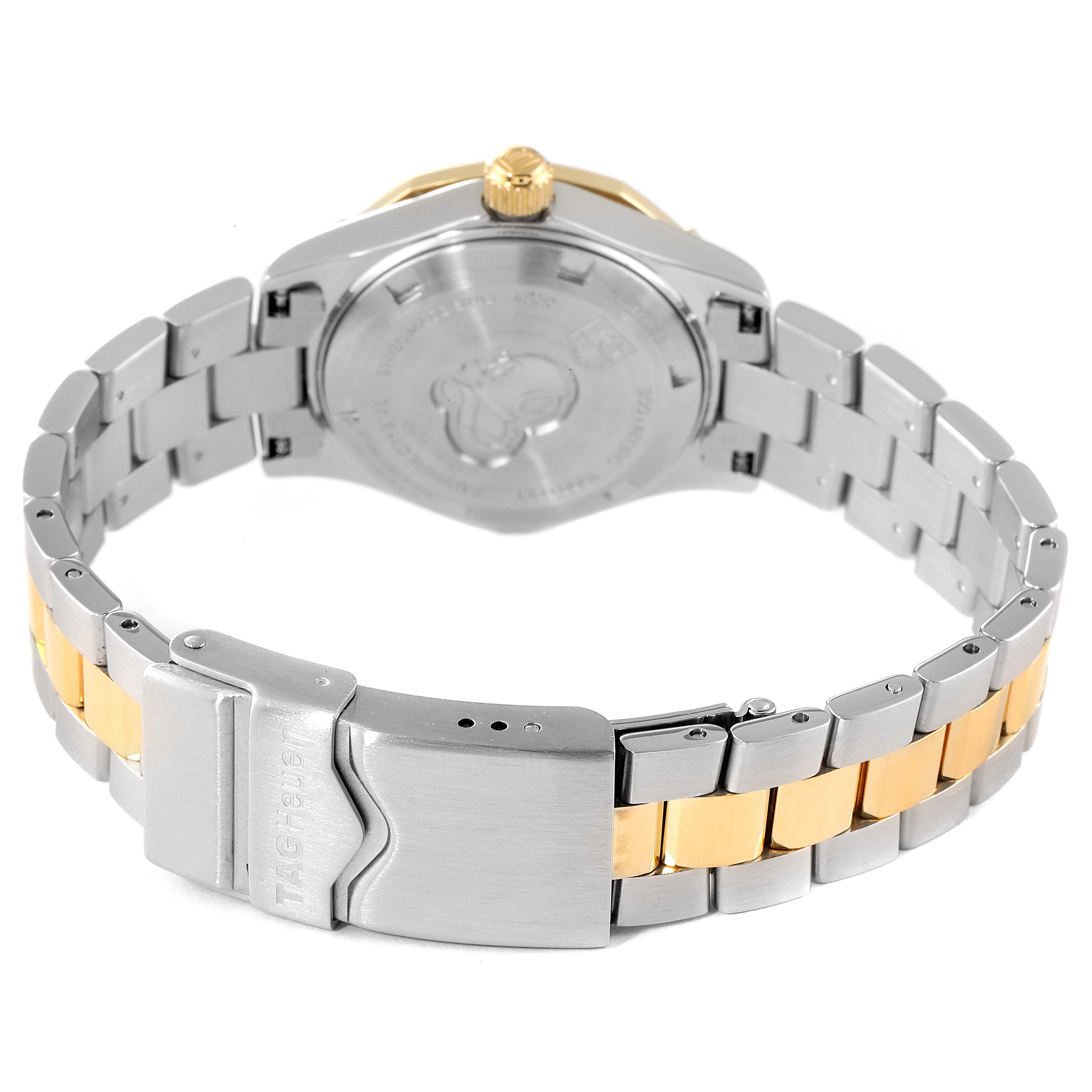 The image shows the back view of a Tag Heuer Aquaracer WAF1450.BA0825 Women's Steel and Gold (two tone) Mother of Pearl Dial WAF1450.BA0825 Women's Steel and Gold (two tone) Mother of Pearl Dial watch, highlighting its clasp, bracelet, and case back.
